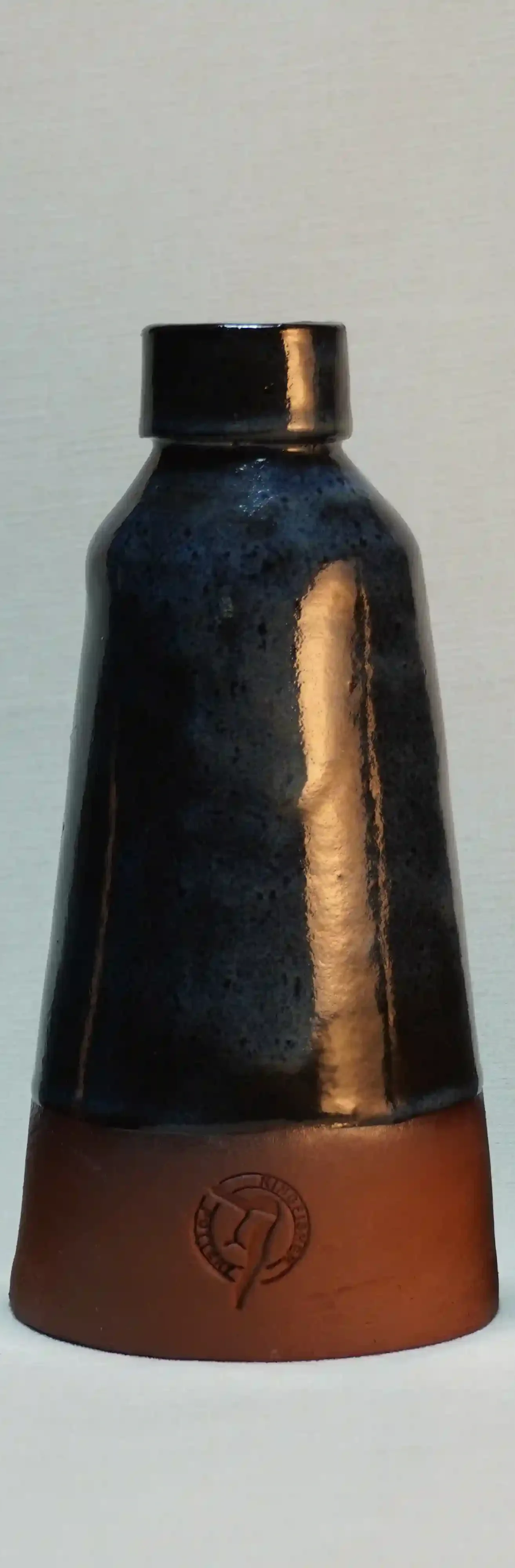 Blue glazed ceramic vase with a terracotta brown base featuring the KINGFISHER POTTERY maker's mark on the front.