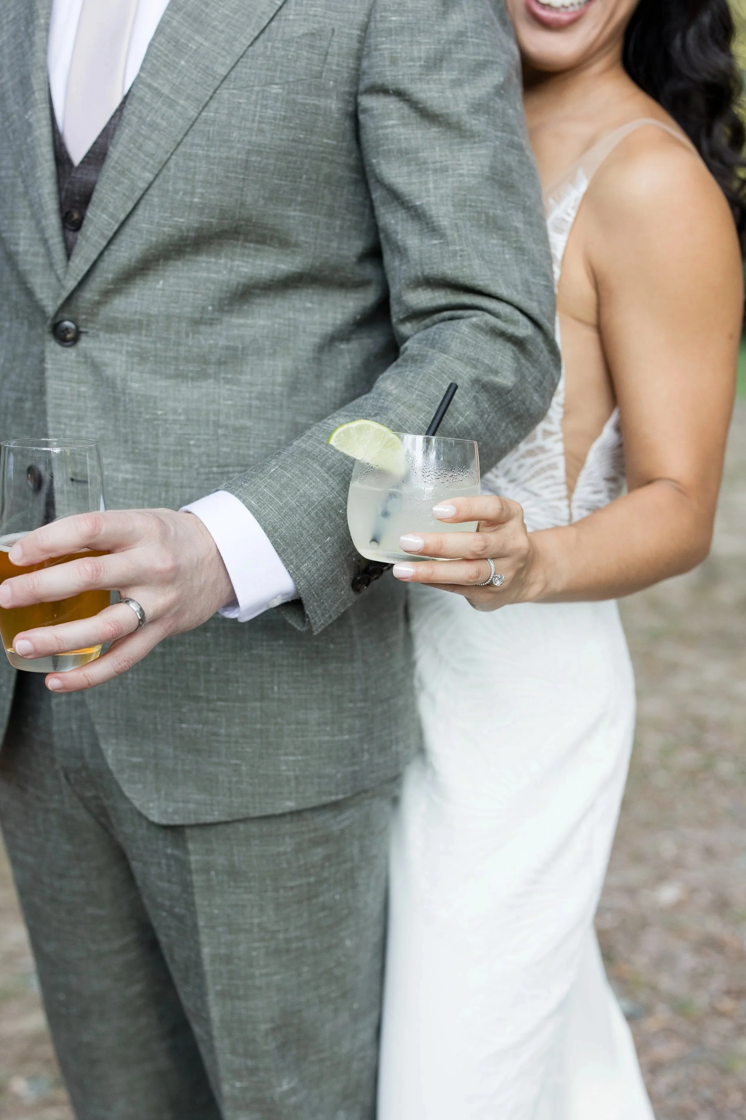 newlyweds-holding-cocktails-wedding-reception.jpg