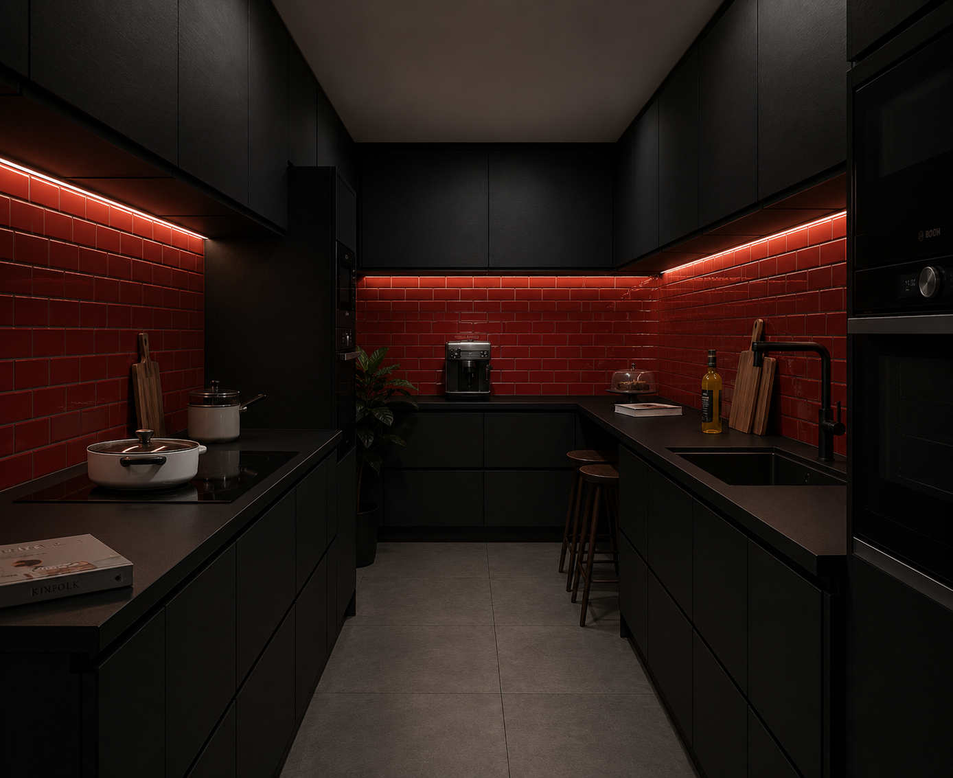 A modern kitchen with black cabinetry, red subway tile backsplash, black countertops, and under-cabinet lighting. It features a coffee maker, cooking pots, chopping boards, a bottle of olive oil, and a sink with a black faucet.
