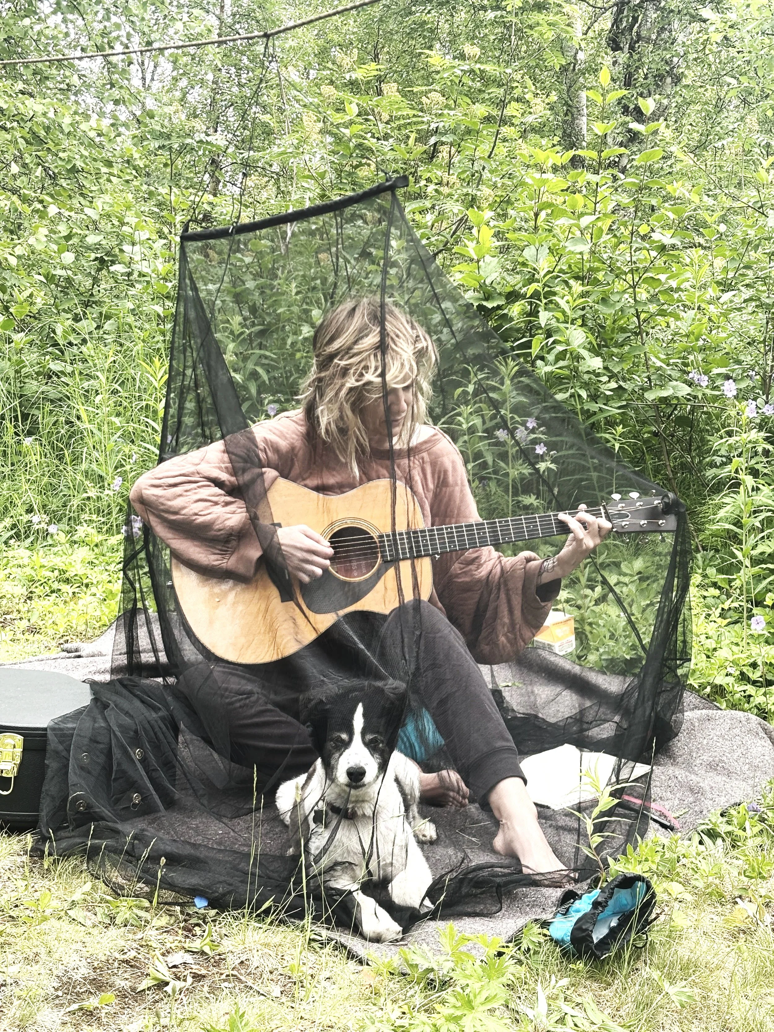 Artist Julie Pack paying guitar