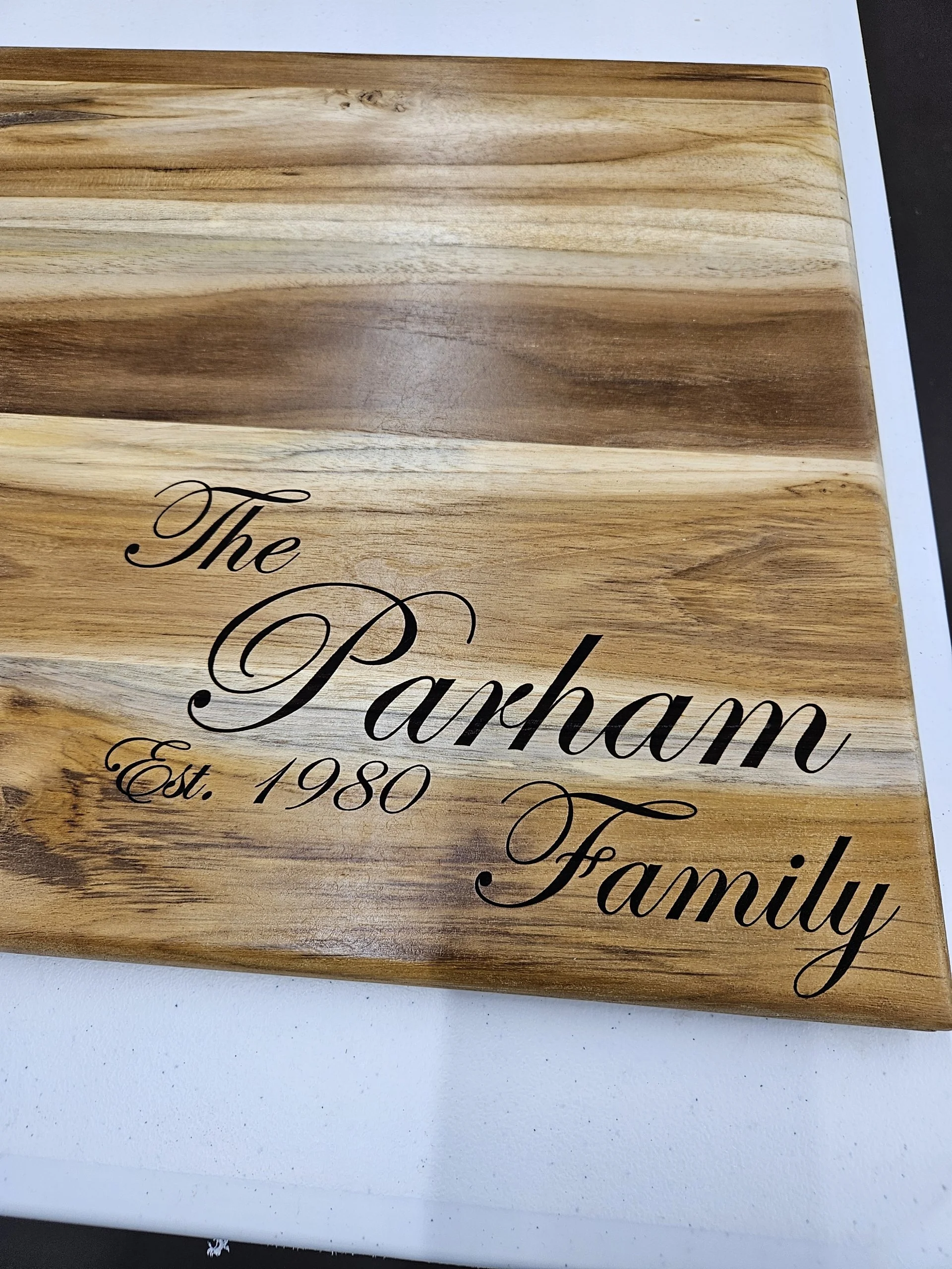Personalized wooden cutting board with custom family name engraving