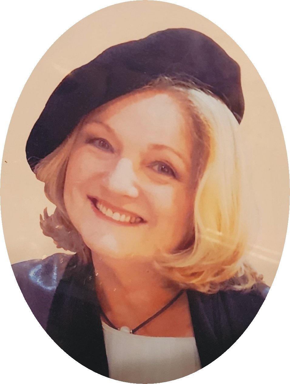 Western Australia artist Lauree Lindsay with blonde hair wearing a black beret and black leather jacket.