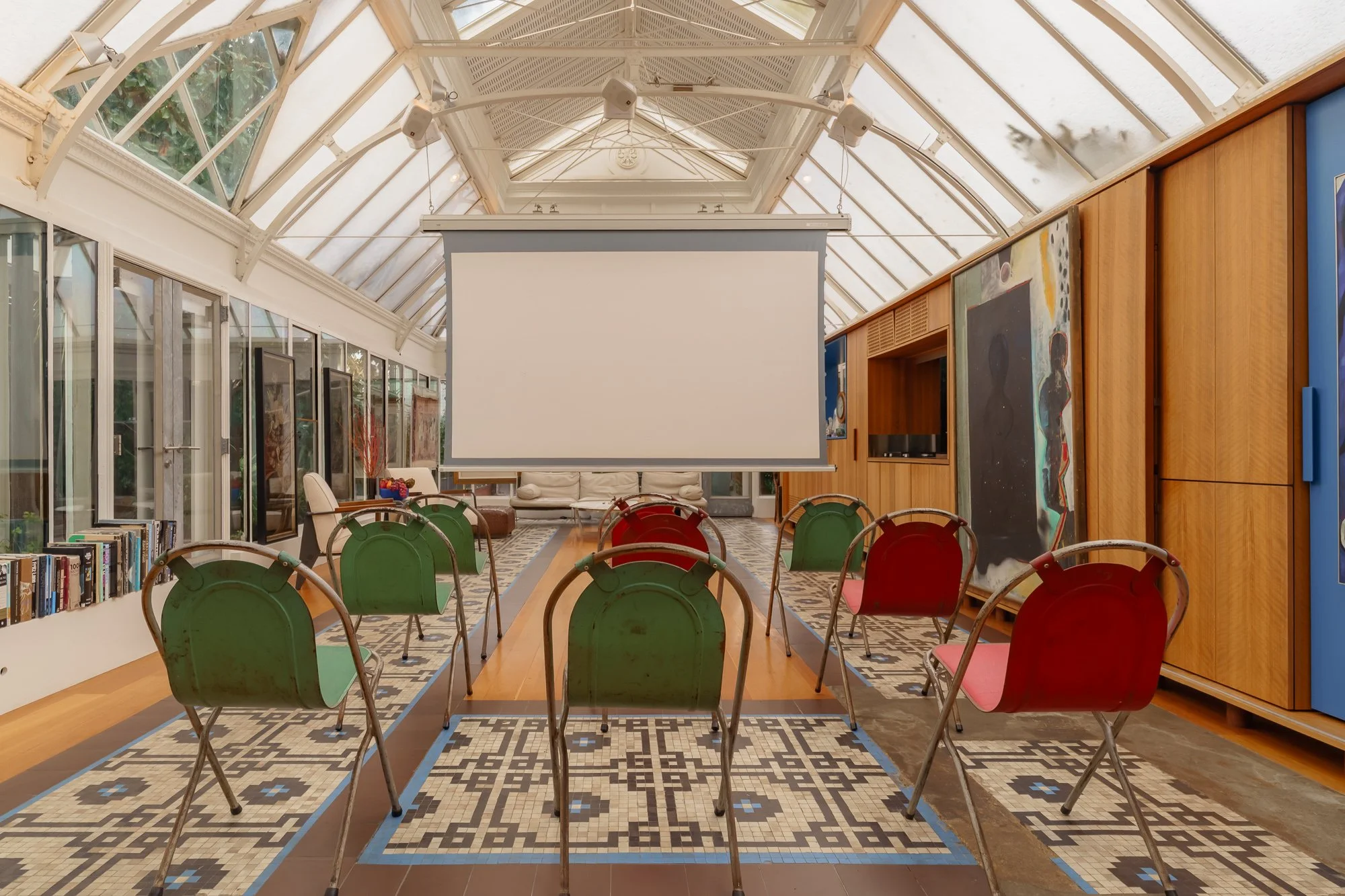 Interior of Conservatory Residency with video projection screen 