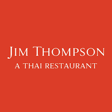 Restaurant sign for Jim Thompson Thai Restaurant with white text on a red background.