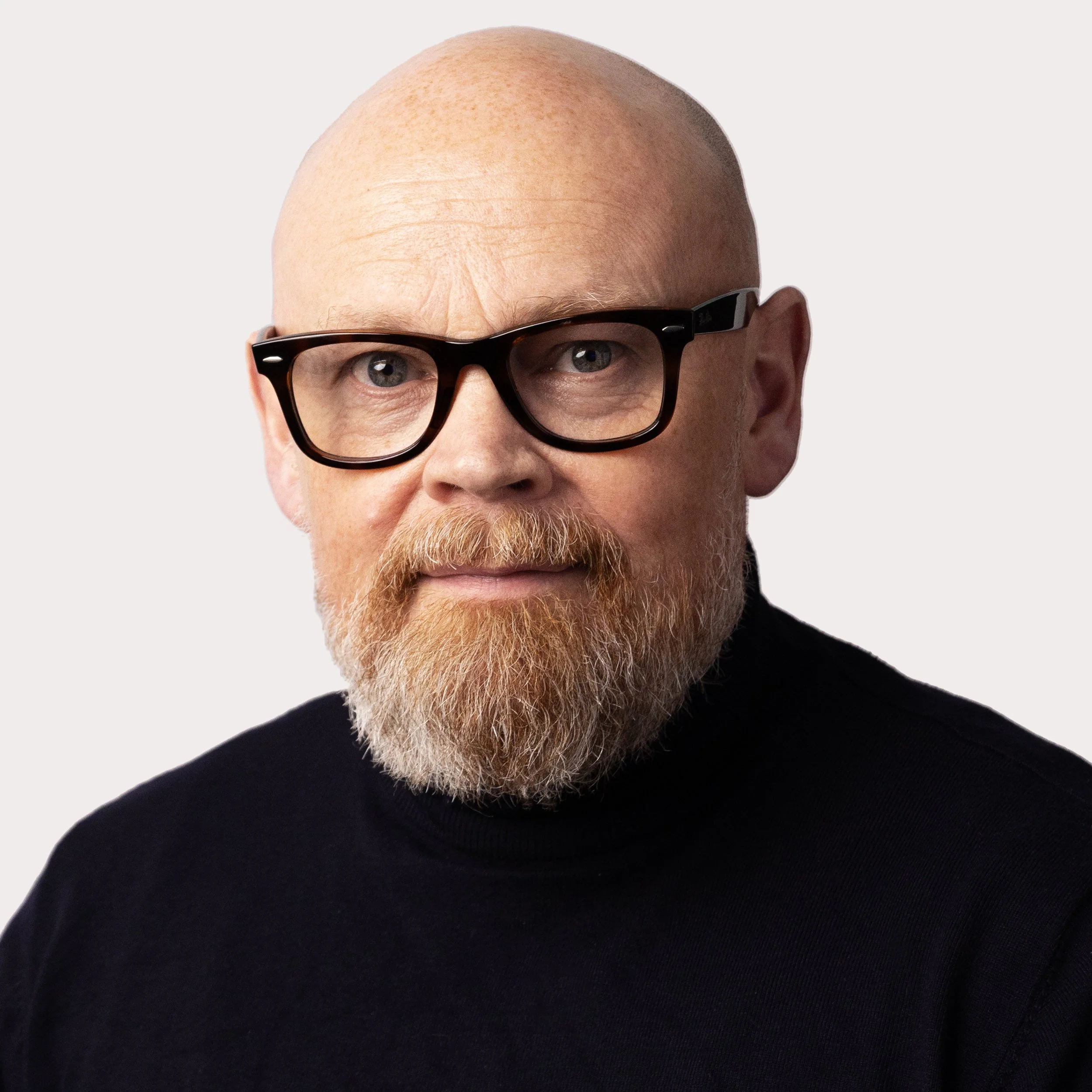 headshot of Mark Hunter, a middle-aged beareded bald man wearing glasses