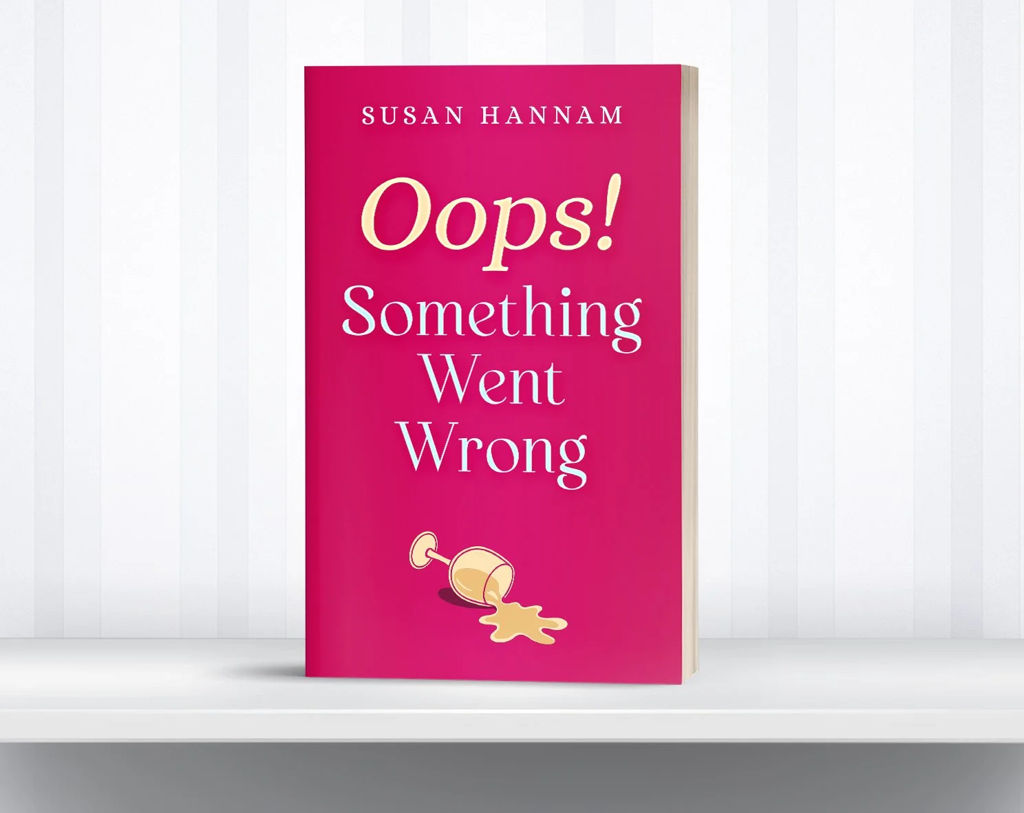 A pink book titled "Oops! Something Went Wrong" by Susan Hannam. The cover features an illustration of a spilled cup of coffee.