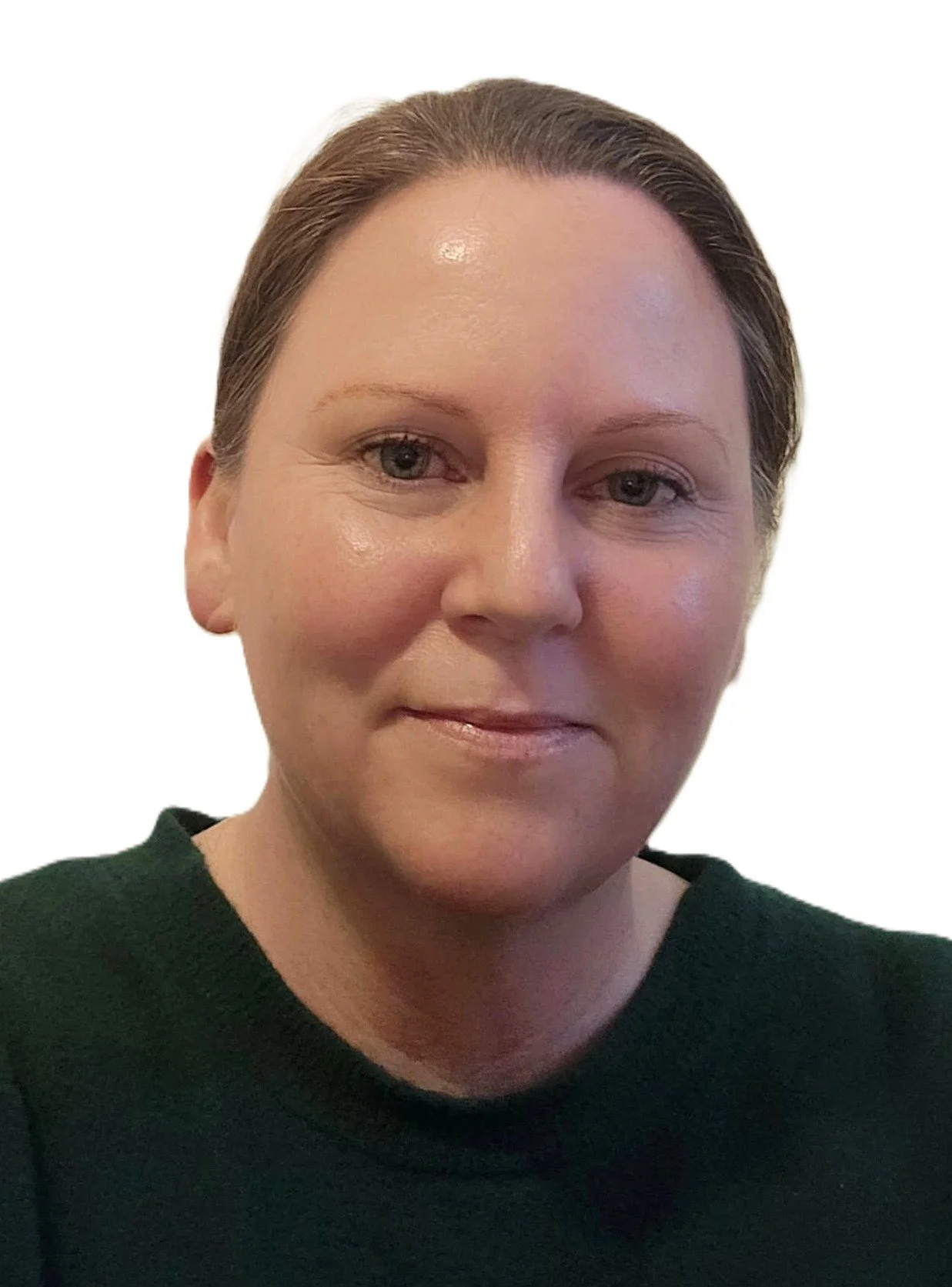 Close-up of a woman with short brown hair, light skin, and wearing a dark green top, looking at the camera with a slight smile.