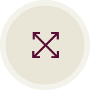 A minimalist logo with four arrows pointing outward in each direction, arranged in a cross pattern, on a light circular background.