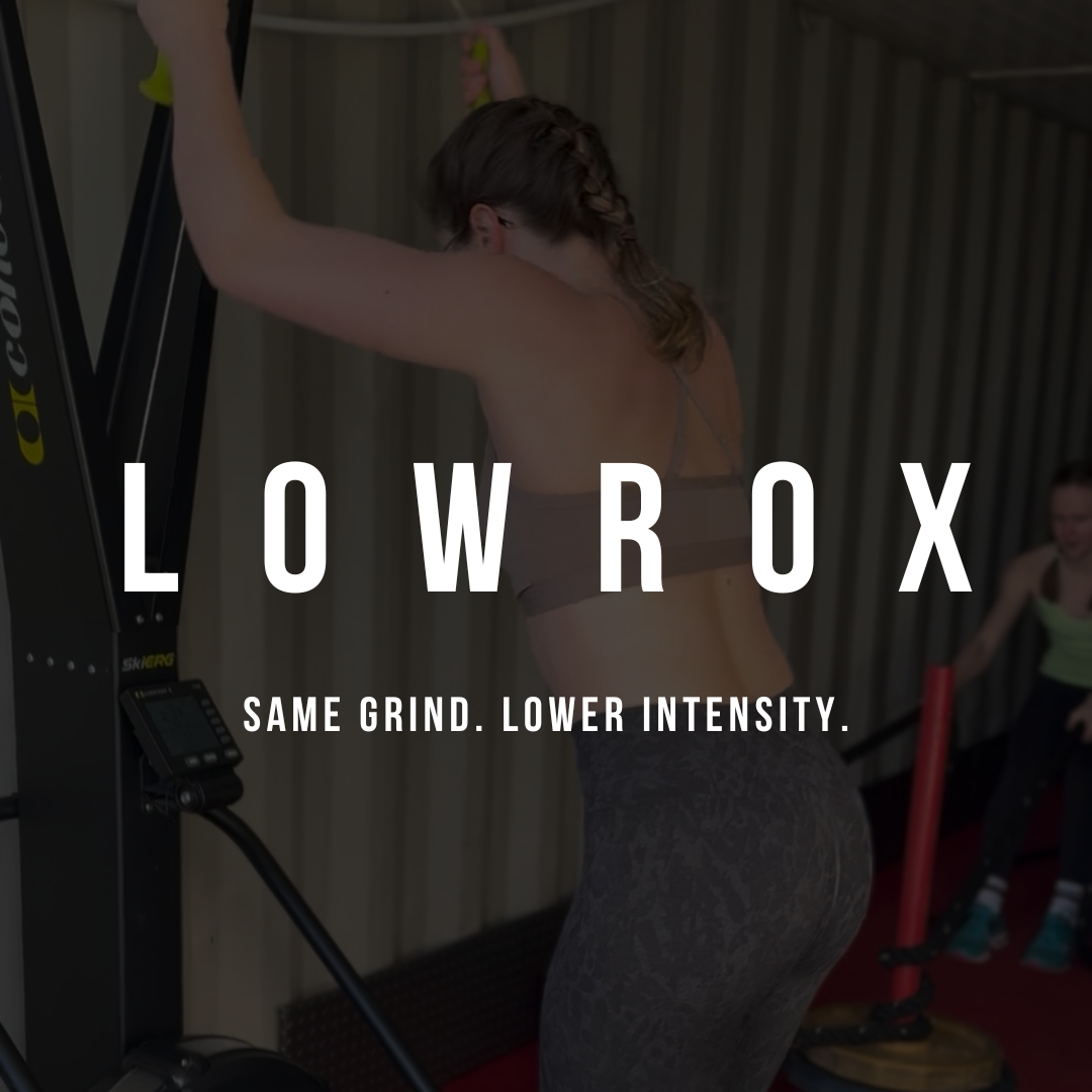 A woman working out on a fitness machine in a gym with a caption promoting LowRoX workout program.