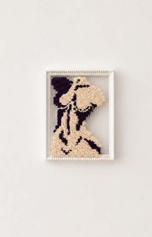 Textile art piece of an abstract female figure on a white background, created with different colored yarns on a loom.