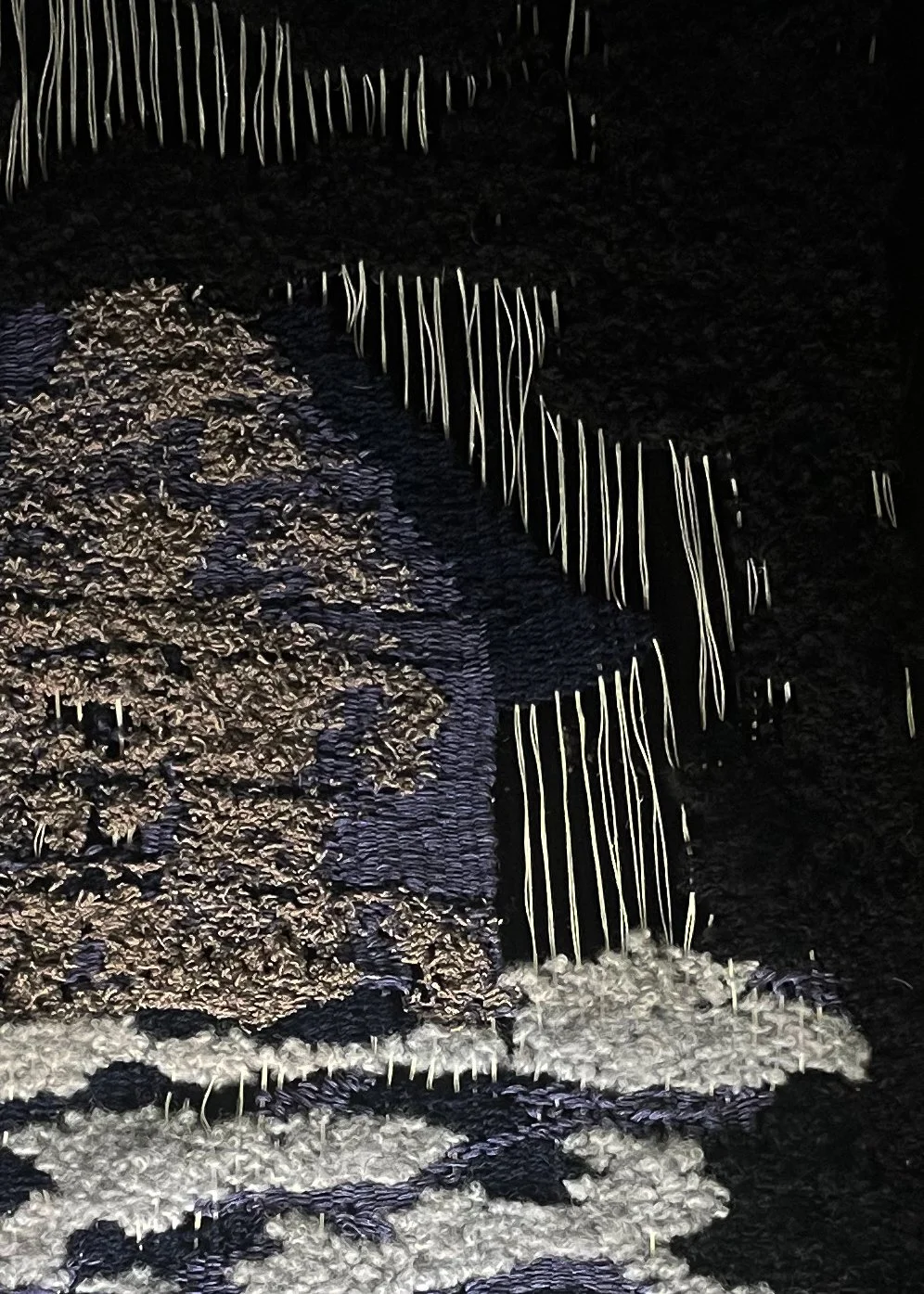 Close-up of textured woven art work woven with boucle yarns.