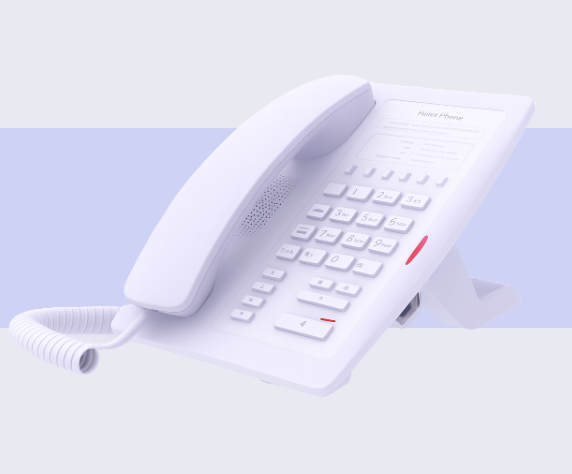 White landline telephone with keypad and handset placed on a stand.