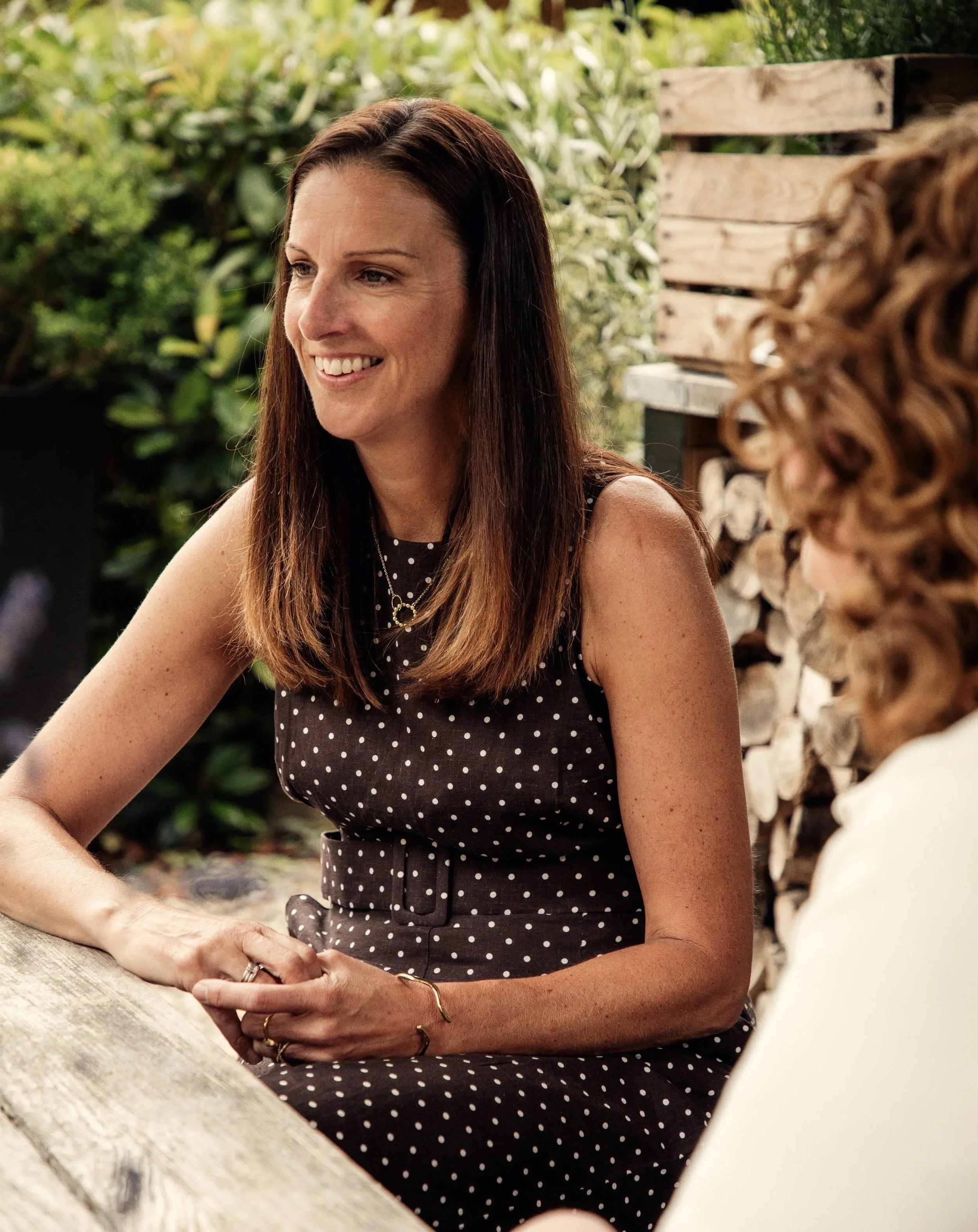 Caroline from Urbanberry Recruitment, specialist travel recruiter, smiling outdoors.