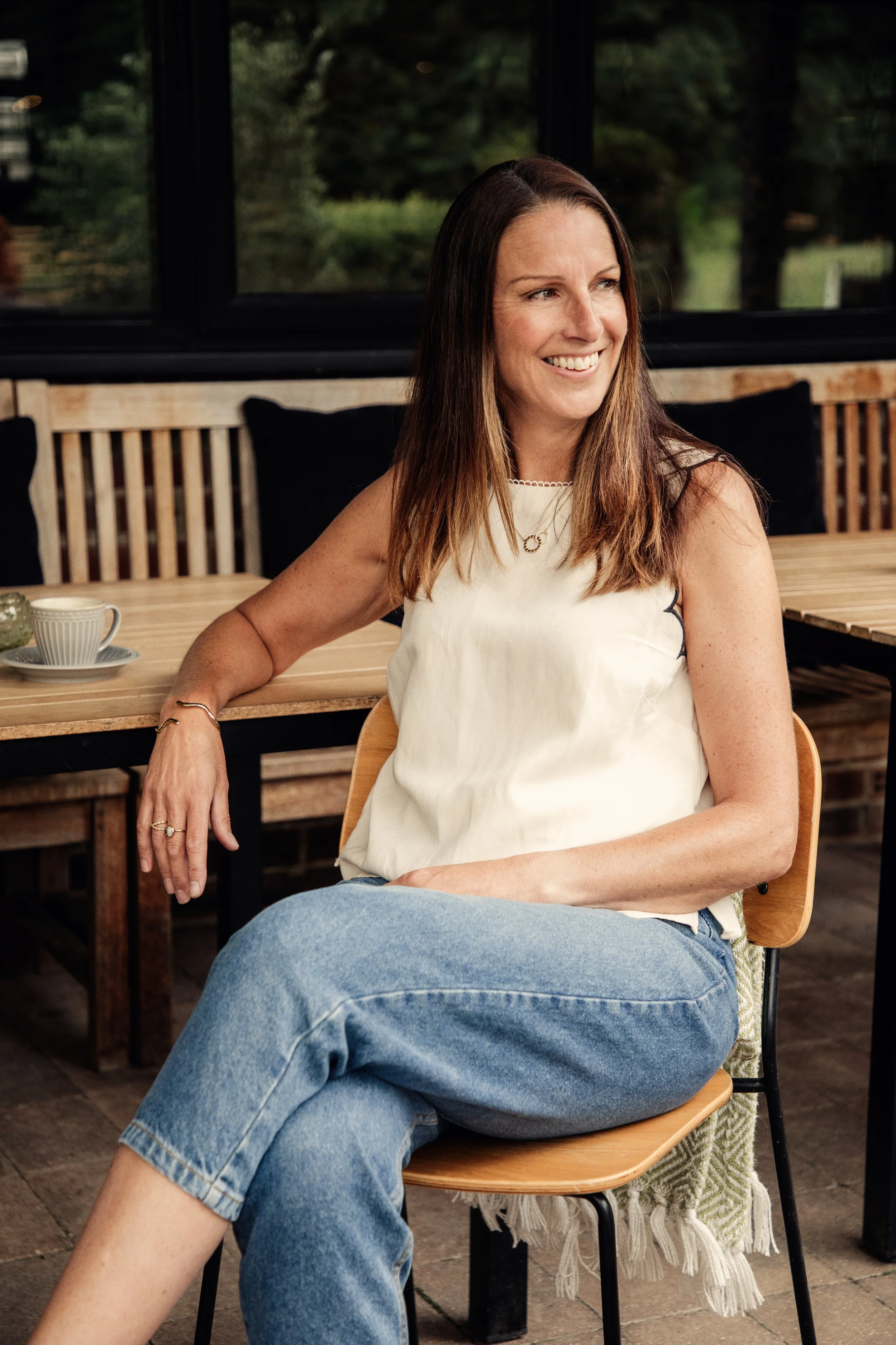 Caroline from Urbanberry Recruitment, specialist travel recruiter, seated by a window.