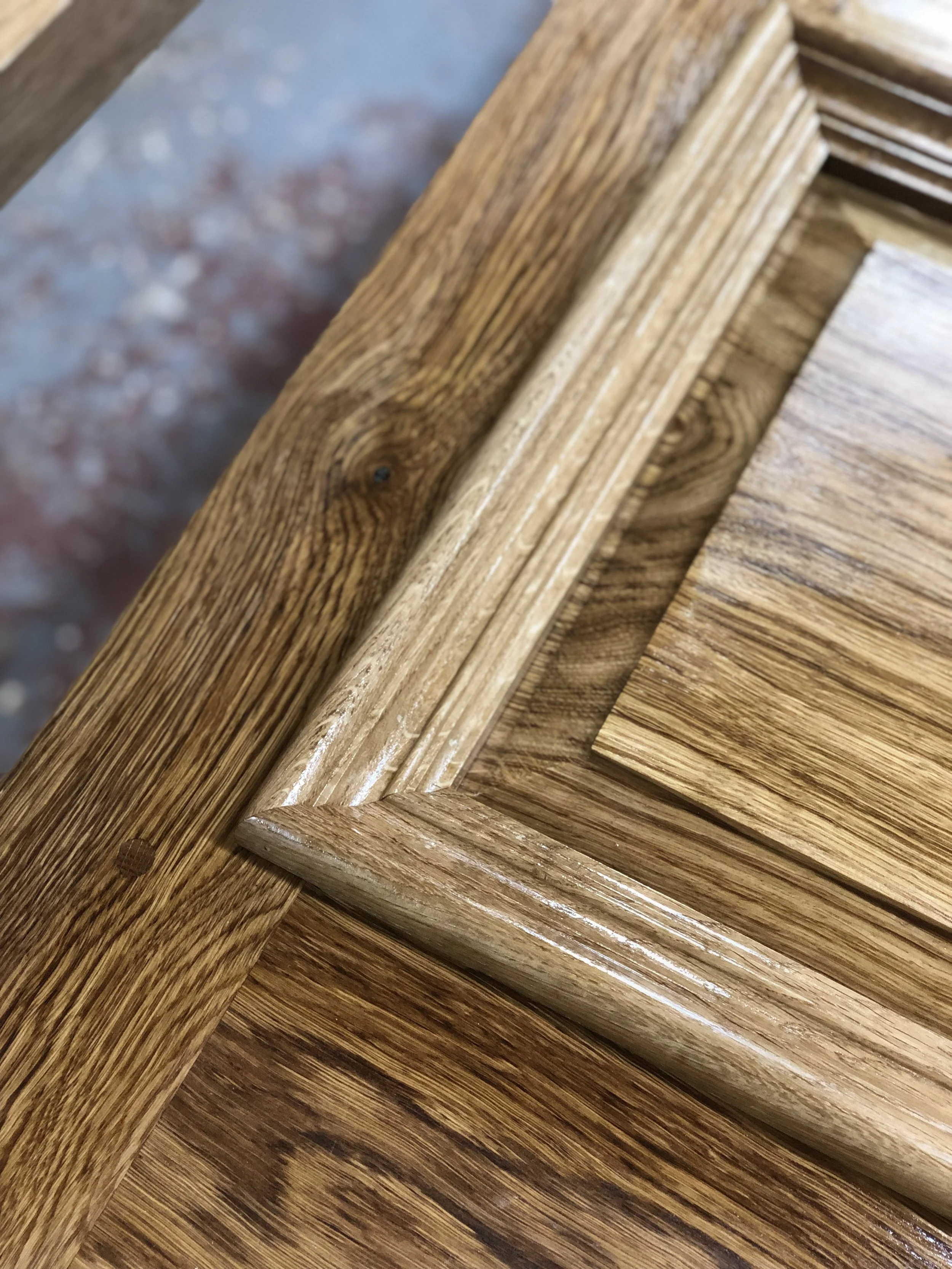 Close-up of stacked wooden planks with visible grain and texture.