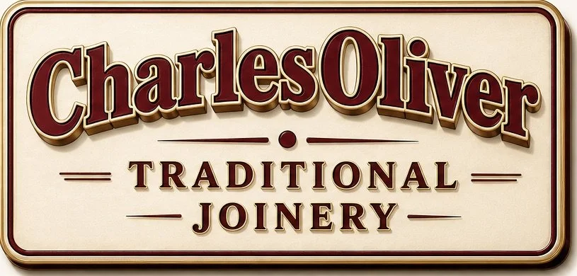 Sign for Charles Oliver Traditional Joinery with large, stylized text.