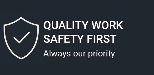 A safety sign with a shield and checkmark, displaying the message 'Quality Work Safety First. Always our priority.'