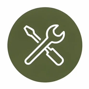 Icon of a screwdriver and wrench crossed on a green circular background.