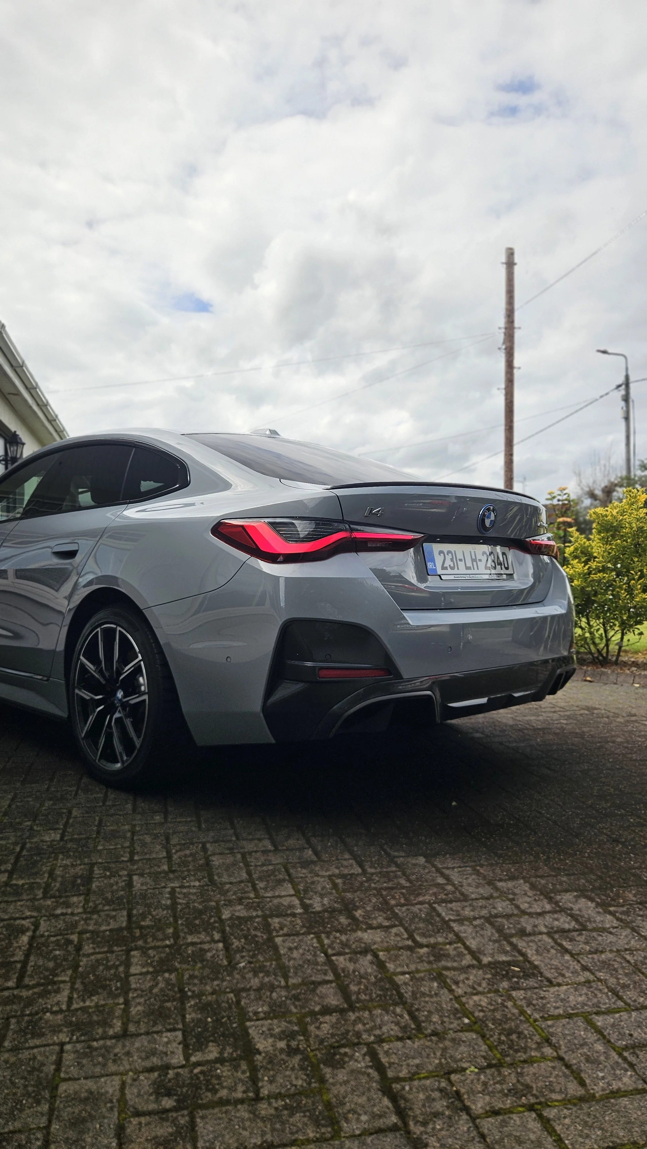 Exterior detail by North East Auto Detailing at home for a silver 2023 BMW I4 on Avenue Road in Dundalk. The exterior Detail included a deep clean, paint decontamination of the lower panels, added protector wax for the paint and wheels and tyre shine