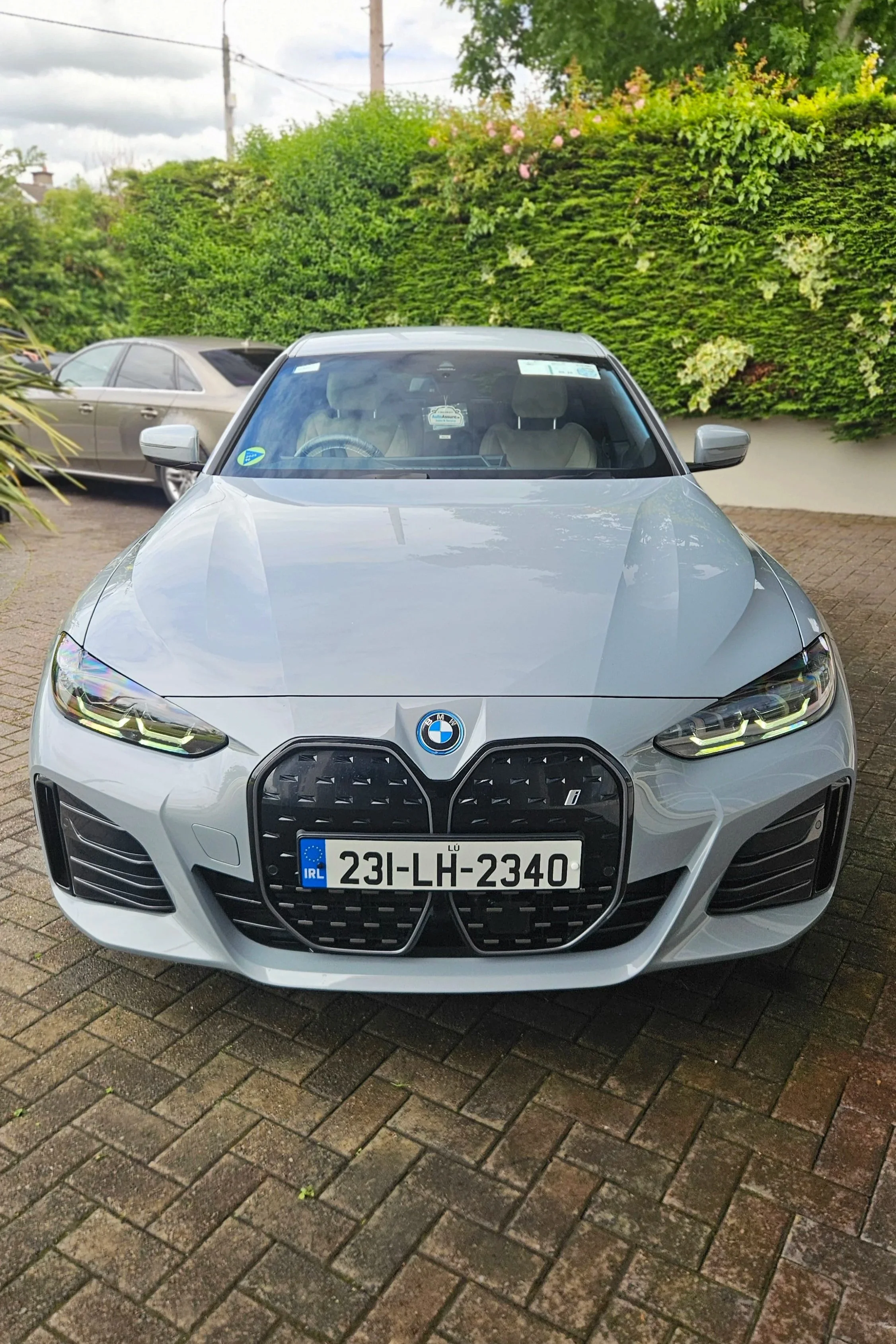 Exterior detail by North East Auto Detailing at home for a silver 2023 BMW I4 on Avenue Road in Dundalk. The exterior Detail included a deep clean, paint decontamination of the lower panels, added protector wax for the paint and wheels and tyre shine