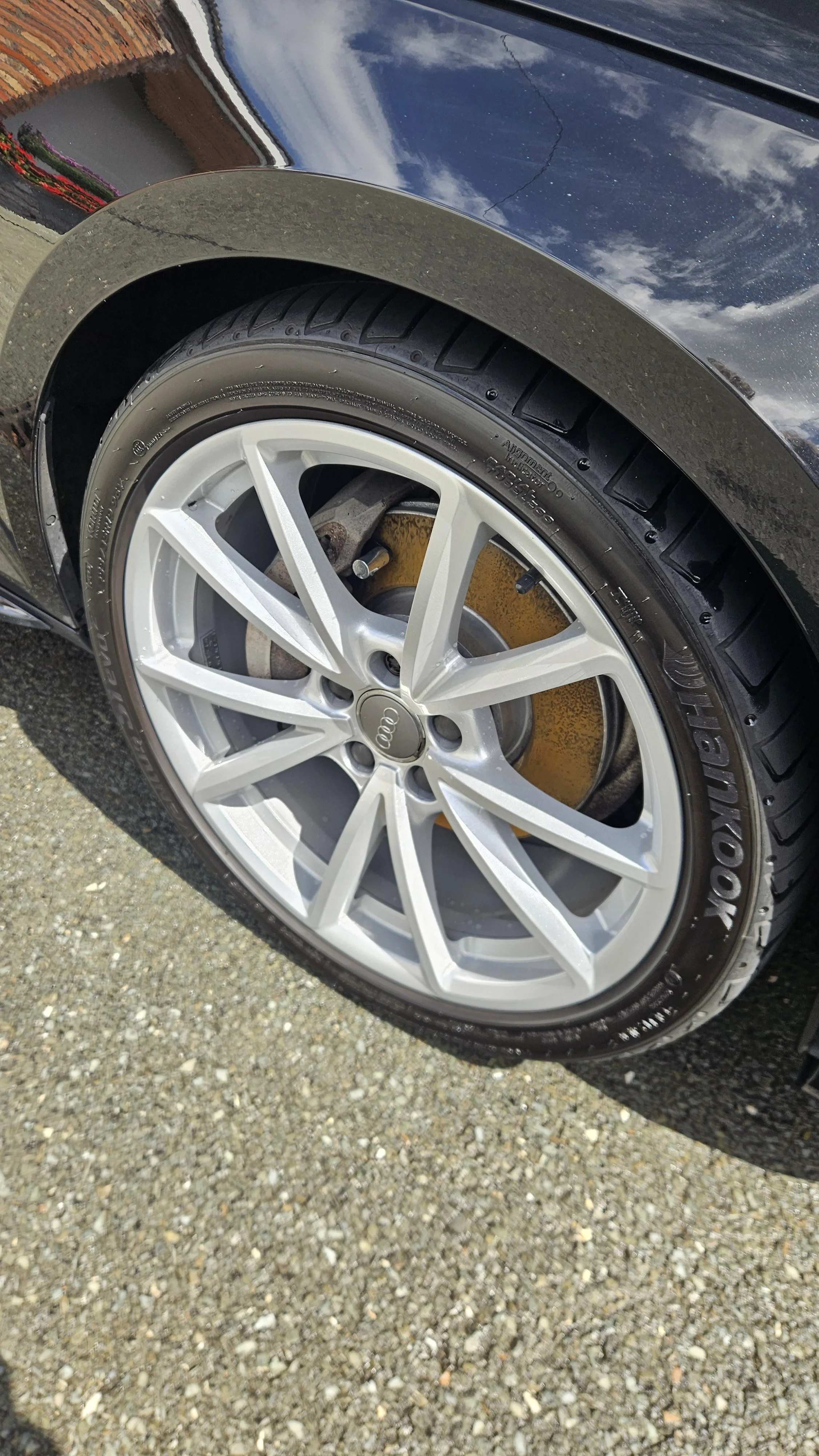 The wheels of an Audi after an Exterior detail by North East Auto Detailing. The wheels went through a deep clean to remove break dust and muck from the wheels and tires through a deep snow foam scrub for the wheel faces, barrels, calipers and tires.