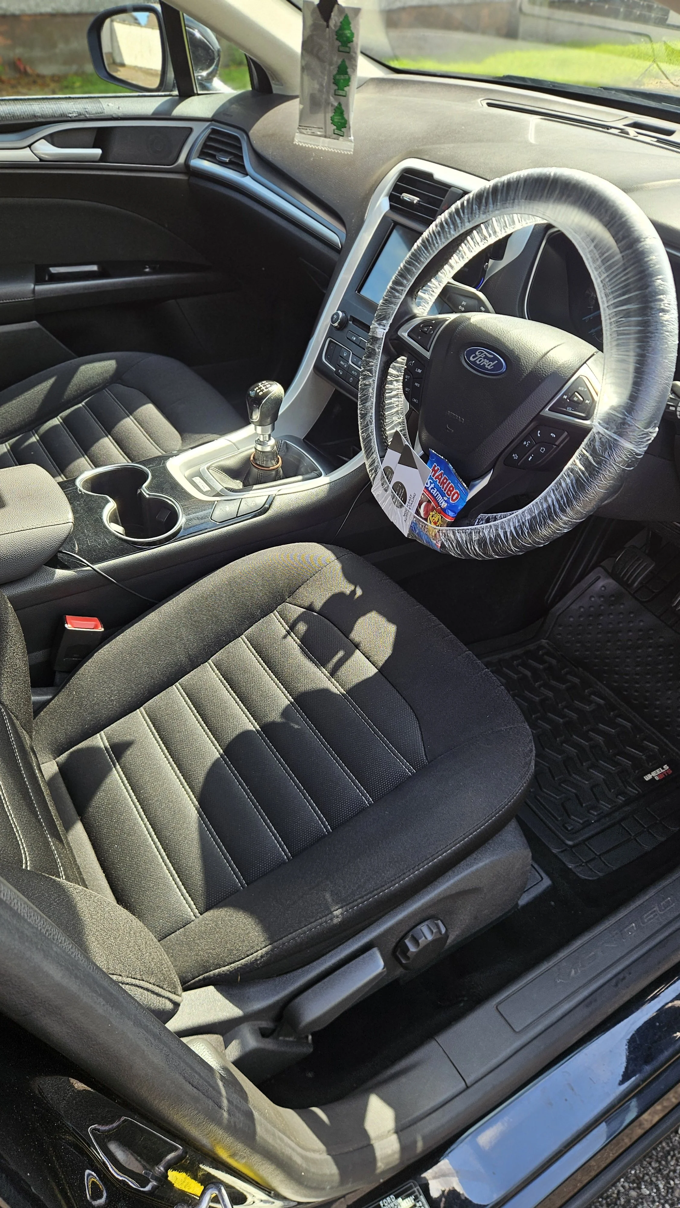 Deep cleaned front seats, center console and dashboard on 2017 Ford Mondeo — interior detailing in Blackrock, Co Louth
