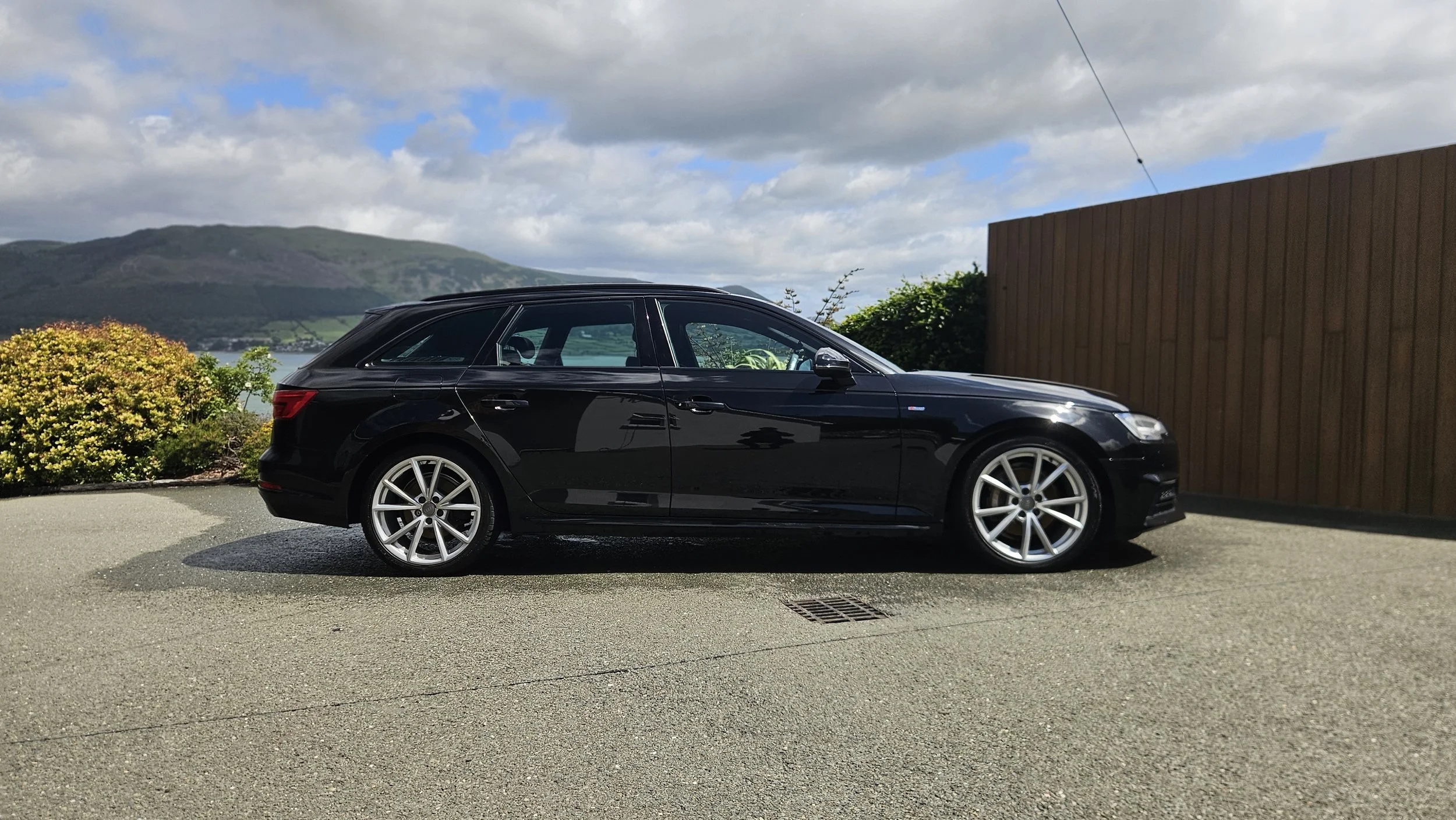 Exterior detail by North East Auto Detailing for a 2017 Black Audi A4 Avant in Carlingford in County Louth. The black paint shows a deep gloss and mirror-like reflection after a full wash and wax,