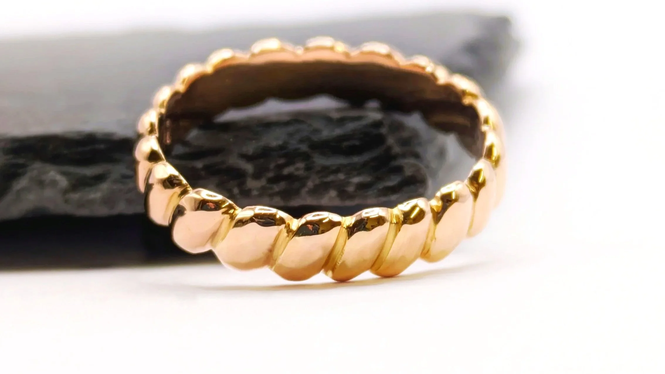 A hand-carved anniversary ring made from heirloom gold