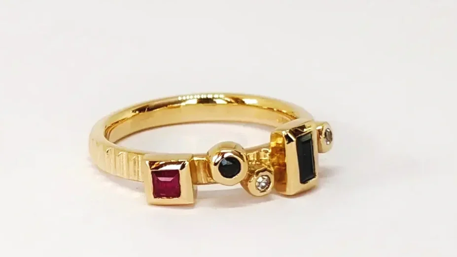 One of a series of stacking rings made using heirloom gold, diamonds, rubies and sapphires
