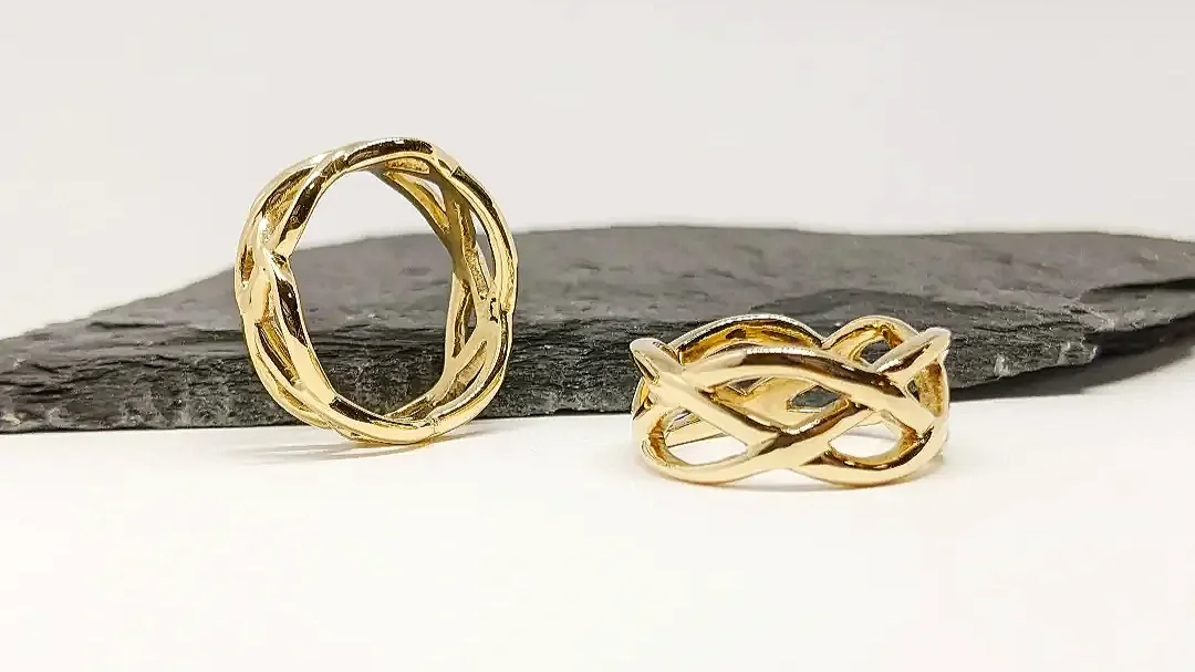 A set of organic celtic knot wedding bands. Celtic knots have great symbolism and meaning. They signify union, family and the idea of lives interweaving together as one. 
