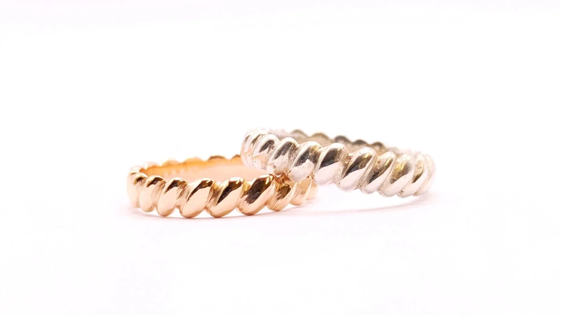 The Twist. A timeless and simple symbol of two lives joining as one. Crafted from the heirloom gold of their parents’ wedding bands, it not only represents their own union, but also carries forward the love and history of the generations before them.
