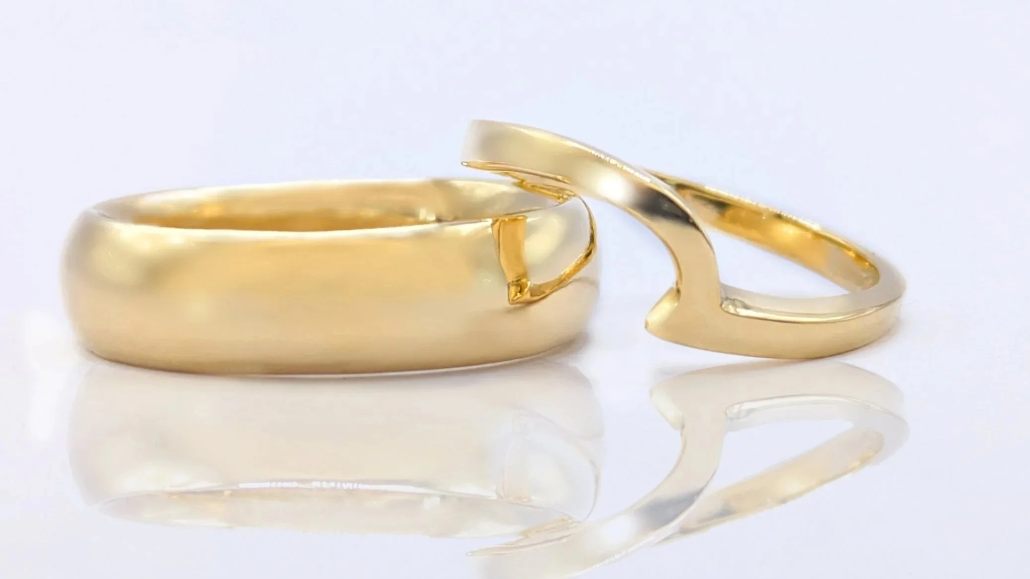 Lord and Lady of the Rings. Inspired by the world of J.R.R. Tolkien, this pairing brings together fantasy and timeless elegance. The larger ring features delicate Elvish inscription, while the smaller band echoes an ethereal, Elvish-inspired style.

