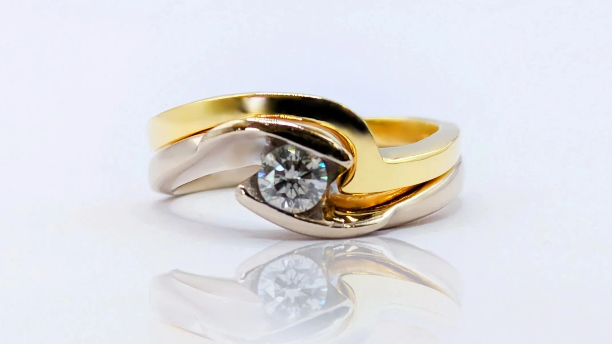 The smaller ring was also designed to sit in harmony with the swooping engagement ring, uniting with it to form a perfectly complementary set. Together, the curves and proportions flow seamlessly, enhancing the overall composition while allowing each