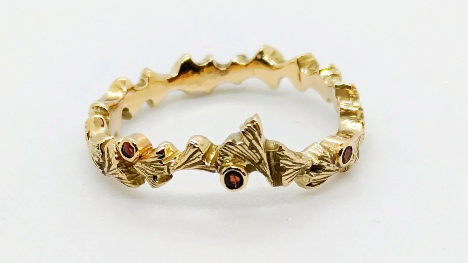 Ginkgo Biloba. Hand carved ring with accent rubies in 18ct yellow gold.