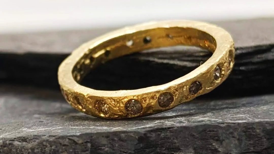 Ancient. An heirloom gold sand-cast ring made to look like and ancient artefact. Features rustically set champagne diamonds.