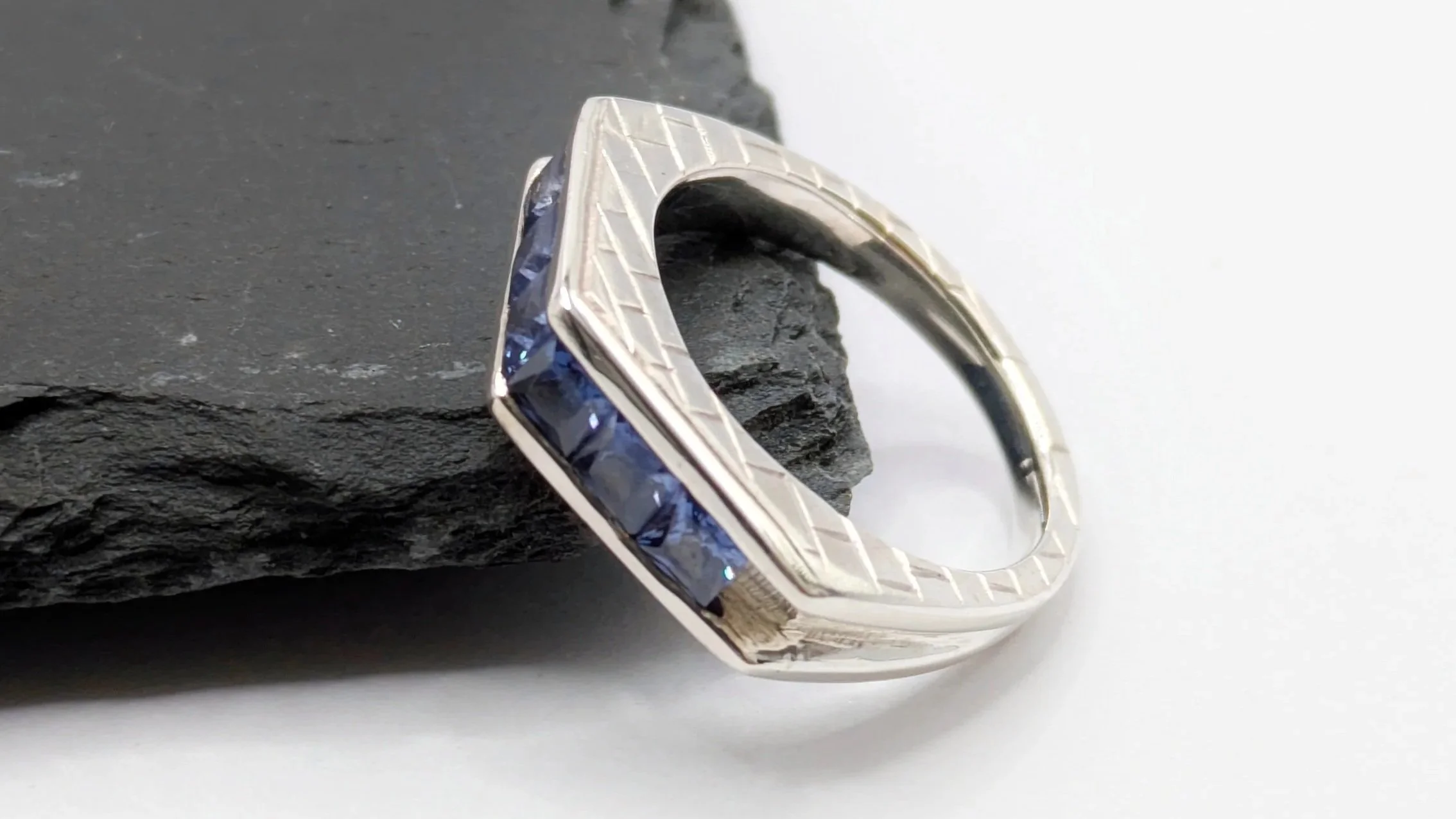 Bridge ring. Inspired by the bridges in Florence with channel set square topazes representing the water.