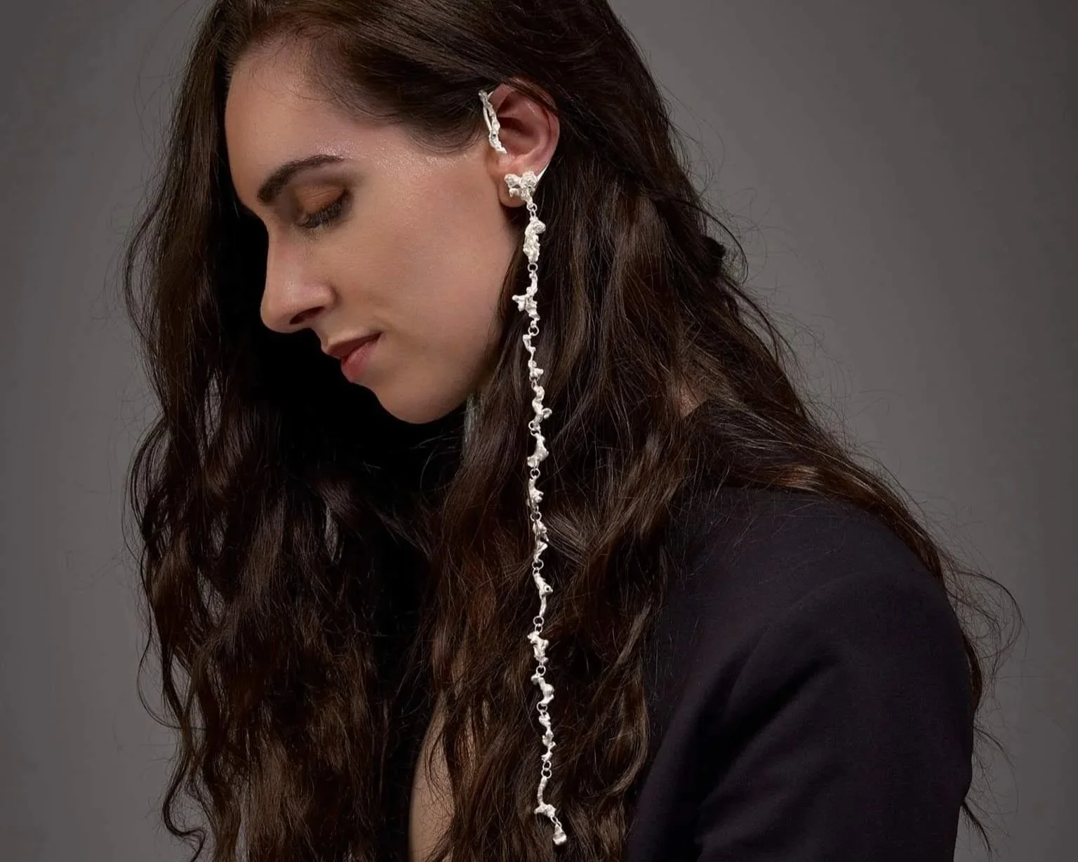Water cast silver ear piece with stones cast in place.