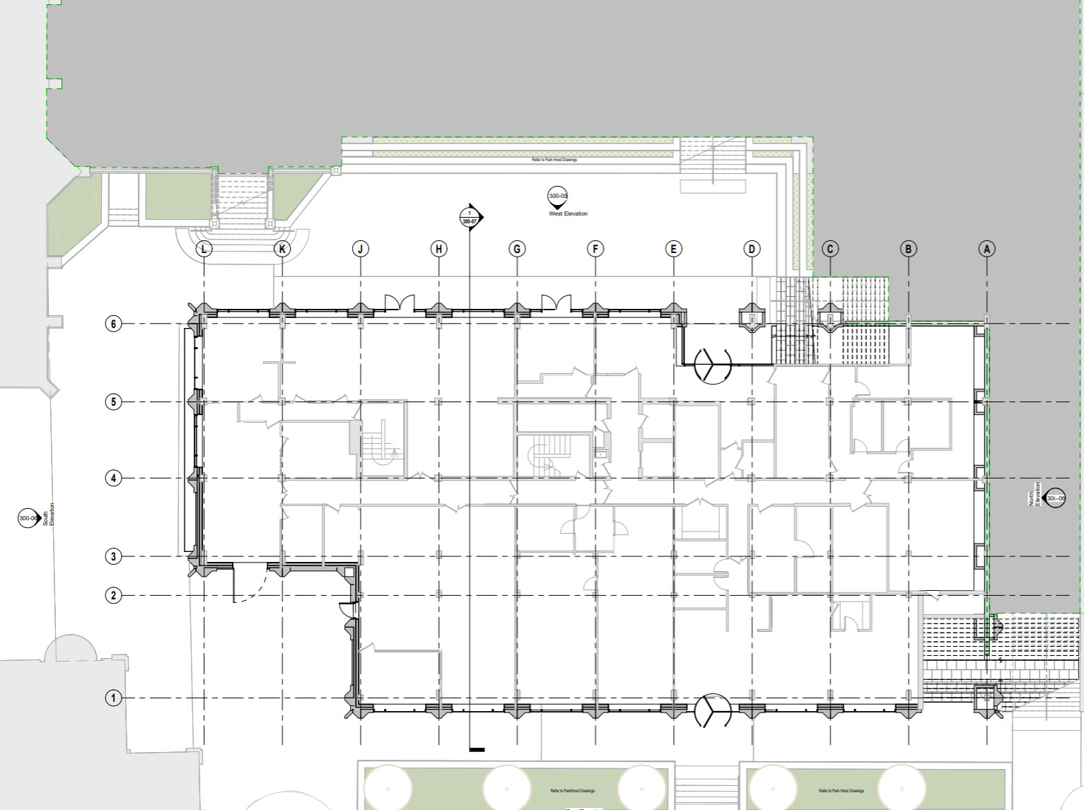 Architectural blueprint of a building floor plan showing rooms, staircases, doors, and exterior stairs, marked with labels and measurements.