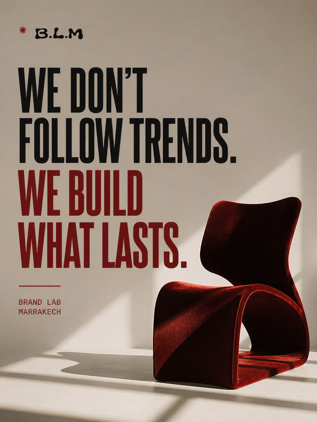 Wall poster with the quote 'We don't follow trends. We build what lasts.' by Brand Lab Marrakech, featuring a modern red chair casting shadows.