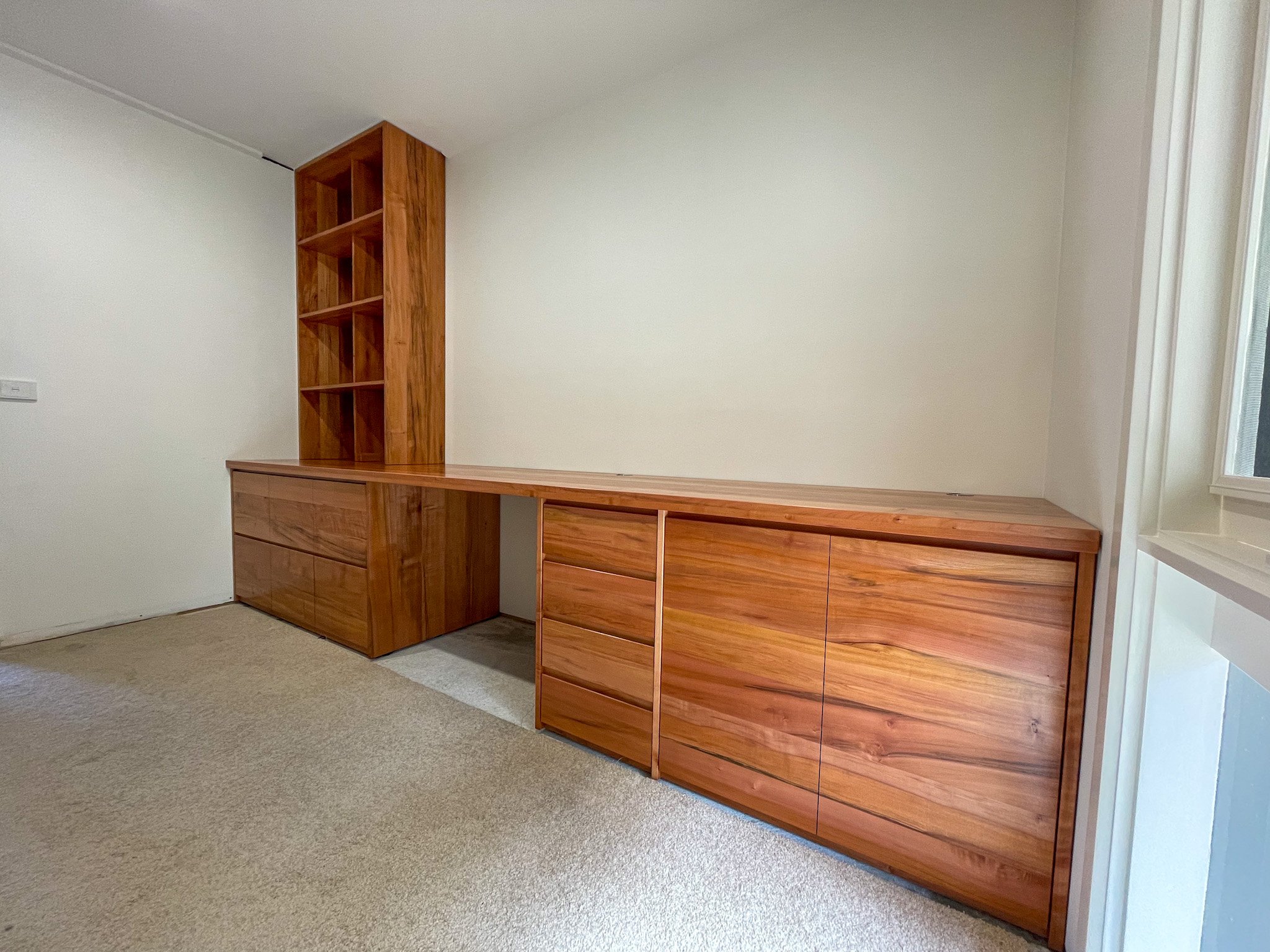 Tasmanian myrtle timber joinery, desk with filling drawers and bookcase to match 