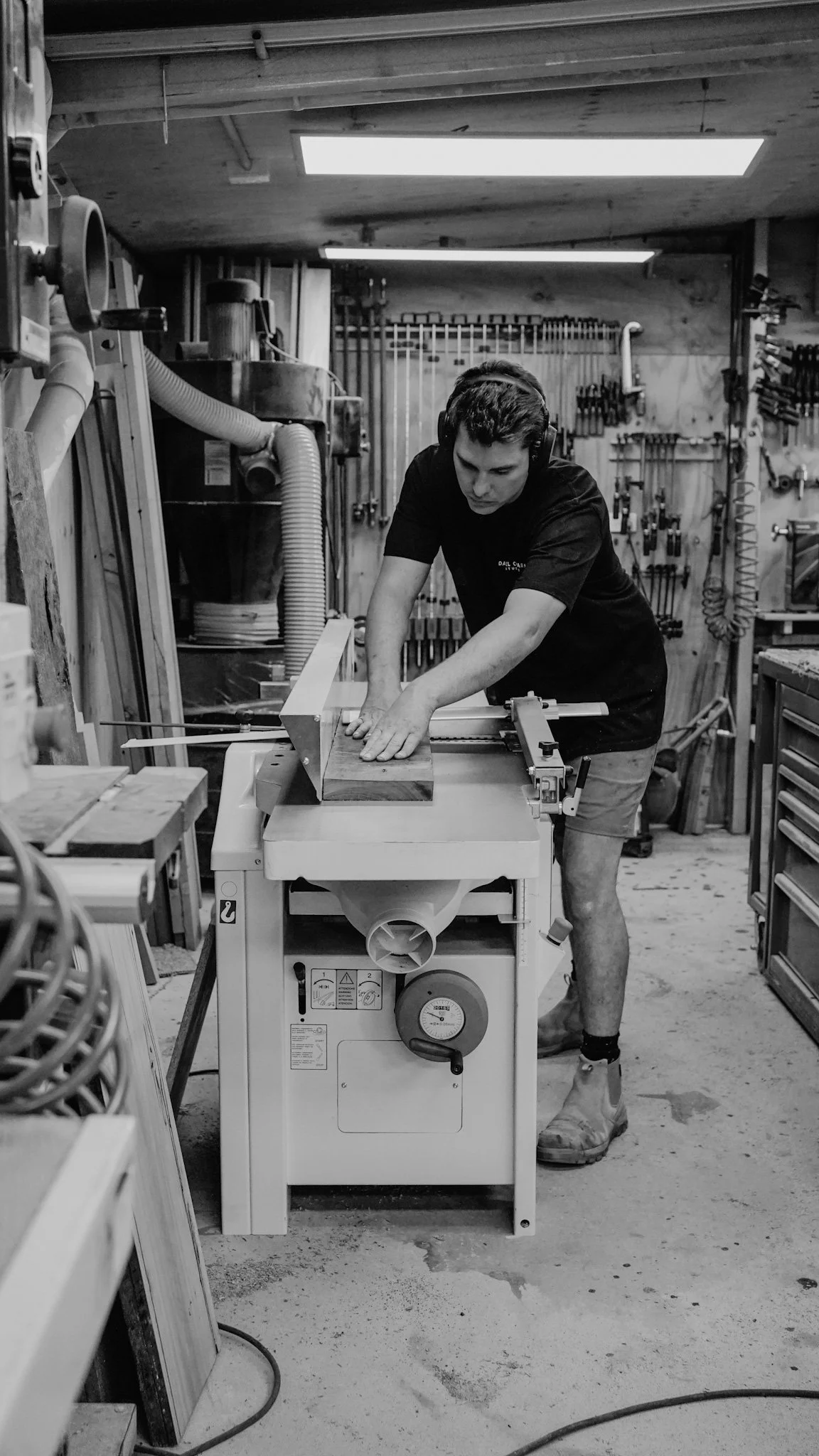 Dan working at the table saw in his Seaford woodworking workshop, Daniel Charles Studio Melbourne