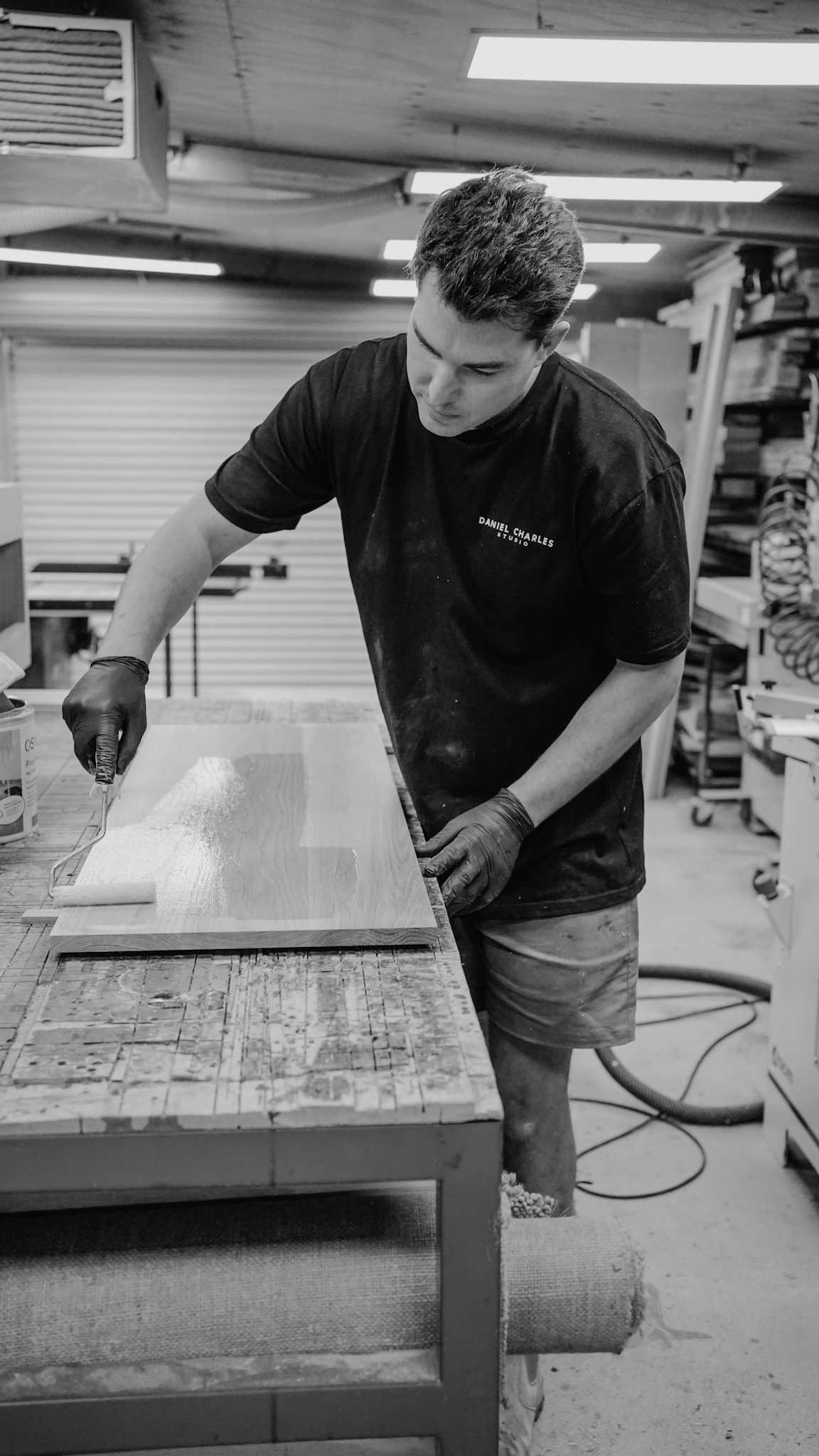 Dan finishing timber in his Seaford woodworking workshop, Daniel Charles Studio Melbourne