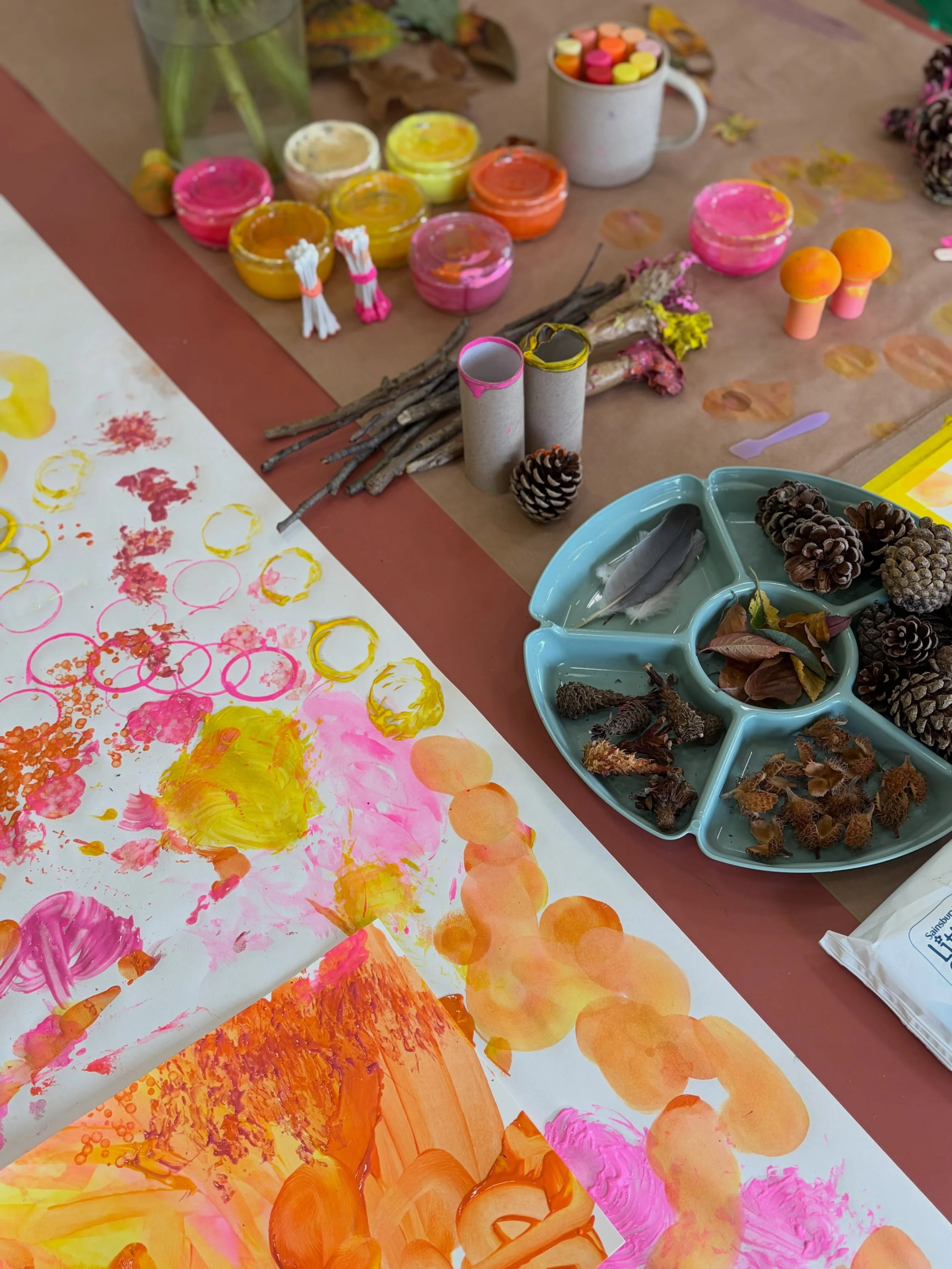 This morning the studio was full of little artists getting stuck in. 

They got messy, made marks, experimented with all sorts of autumnal objects as paintbrushes and explored what happened when they smudged, splattered, dragged, dabbed and got their