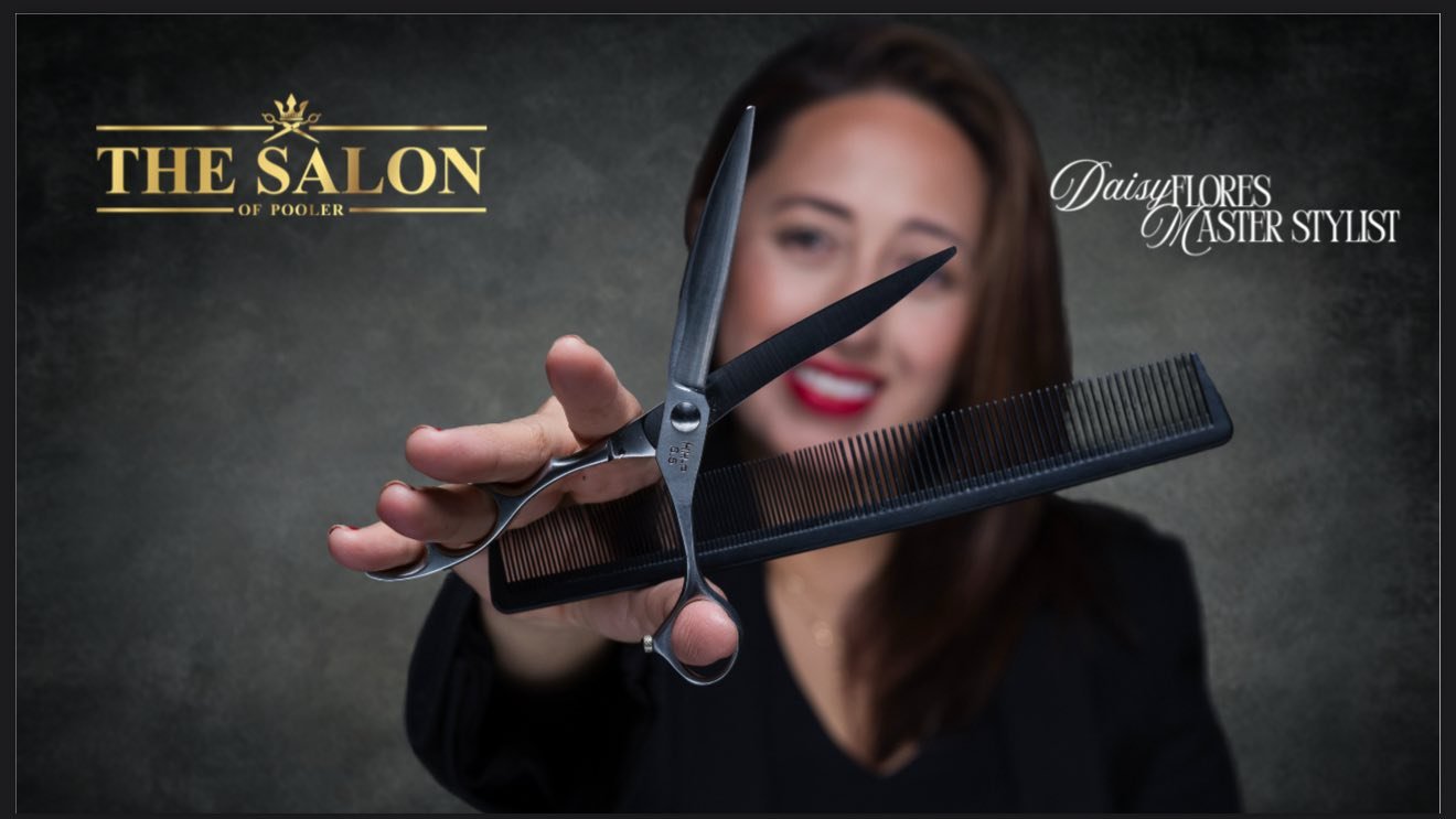 A woman holding a pair of scissors and a comb in front of the camera, with her face slightly blurred in the background. The image promotes a salon.