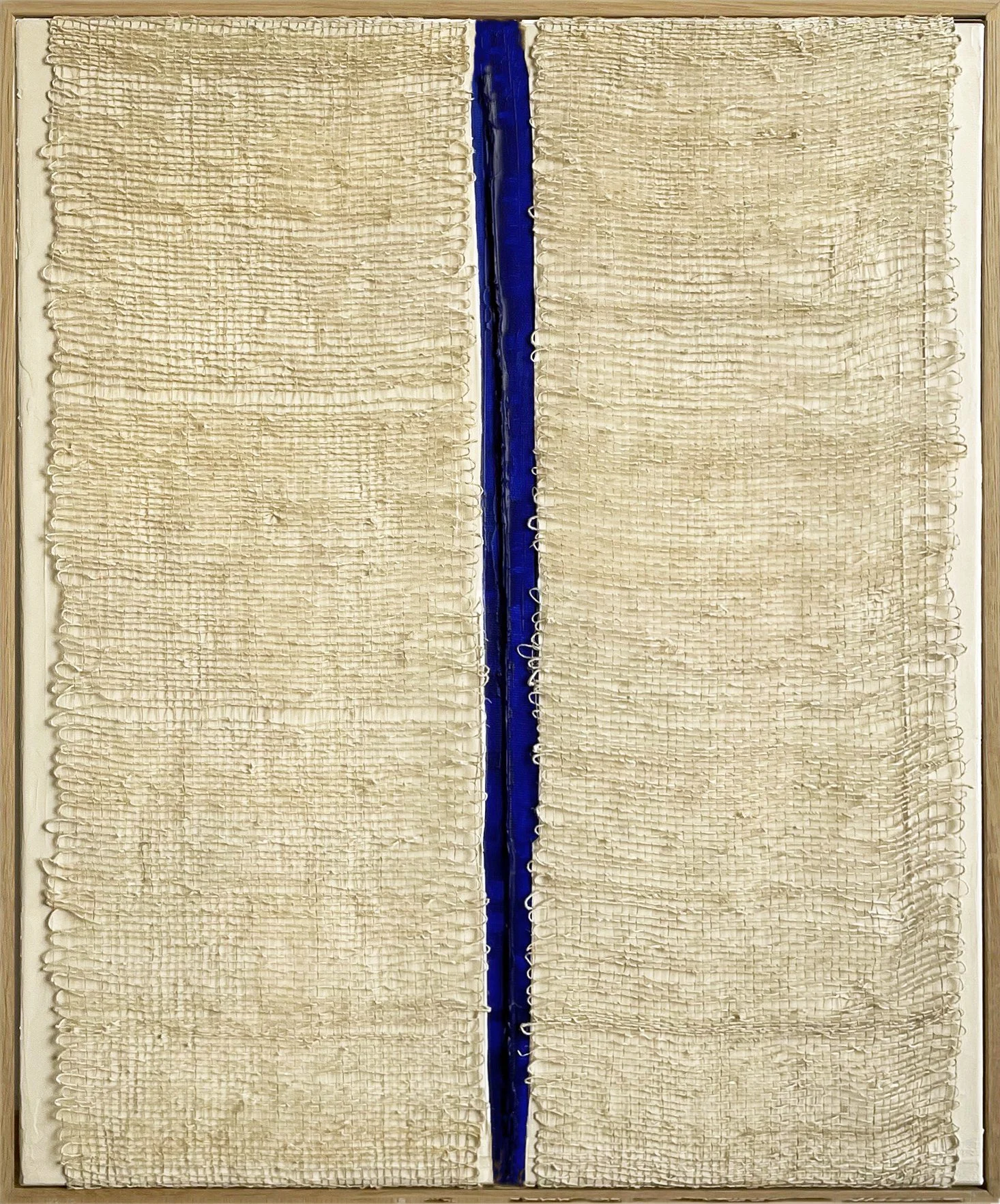 Gap VIII by Aggeliki Dimitriadou. Hand-woven hemp fiber on canvas featuring a striking vertical gap that reveals a deep blue acrylic background. Exploration of textile texture and monochromatic color.