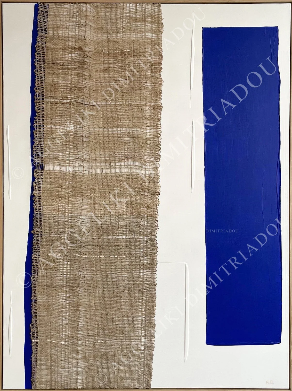 Abstract mixed media artwork "Synthesis III" by Aggeliki Dimitriadou, featuring a long vertical nettle weaving alongside a bold blue acrylic column on a white textured canvas.