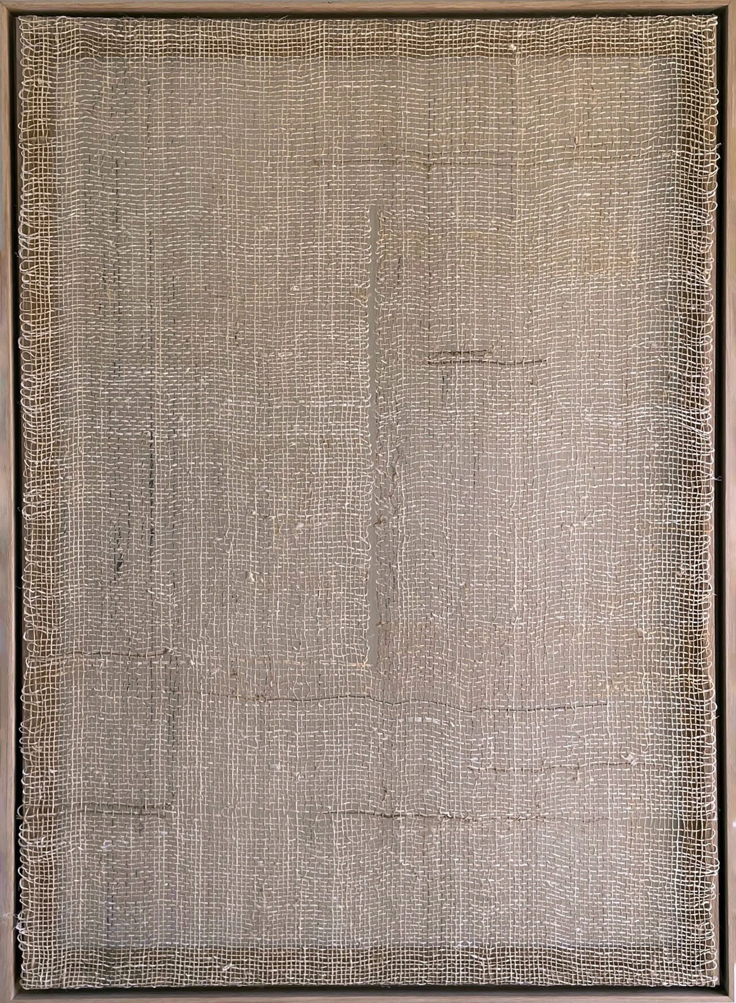 Gap III by Aggeliki Dimitriadou. Minimalist fiber art from the Gaps series. Features raw hemp weaving on a wooden frame, emphasizing the interplay of light and shadow through the textile.