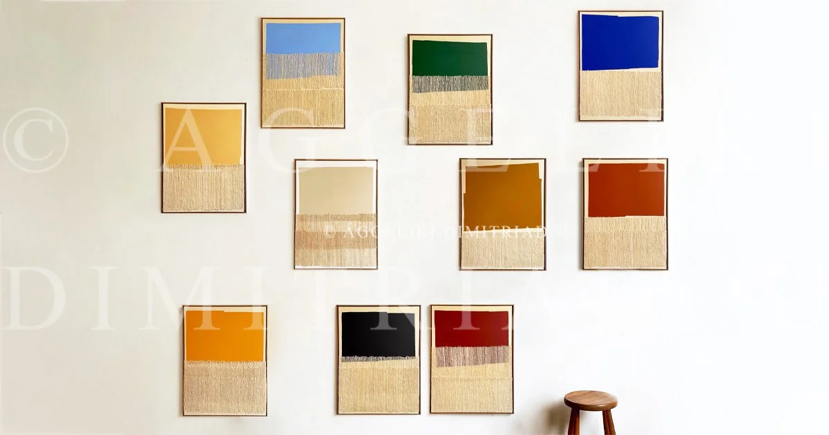 Wall of framed abstract art with colorful rectangular blocks in various shades, including yellow, blue, green, beige, brown, orange, black, and red, Polymorphism series by Aggeliki Dimitriadou.