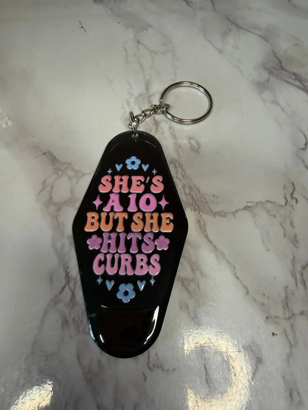 She's a 10 but hits curbs - Keyring