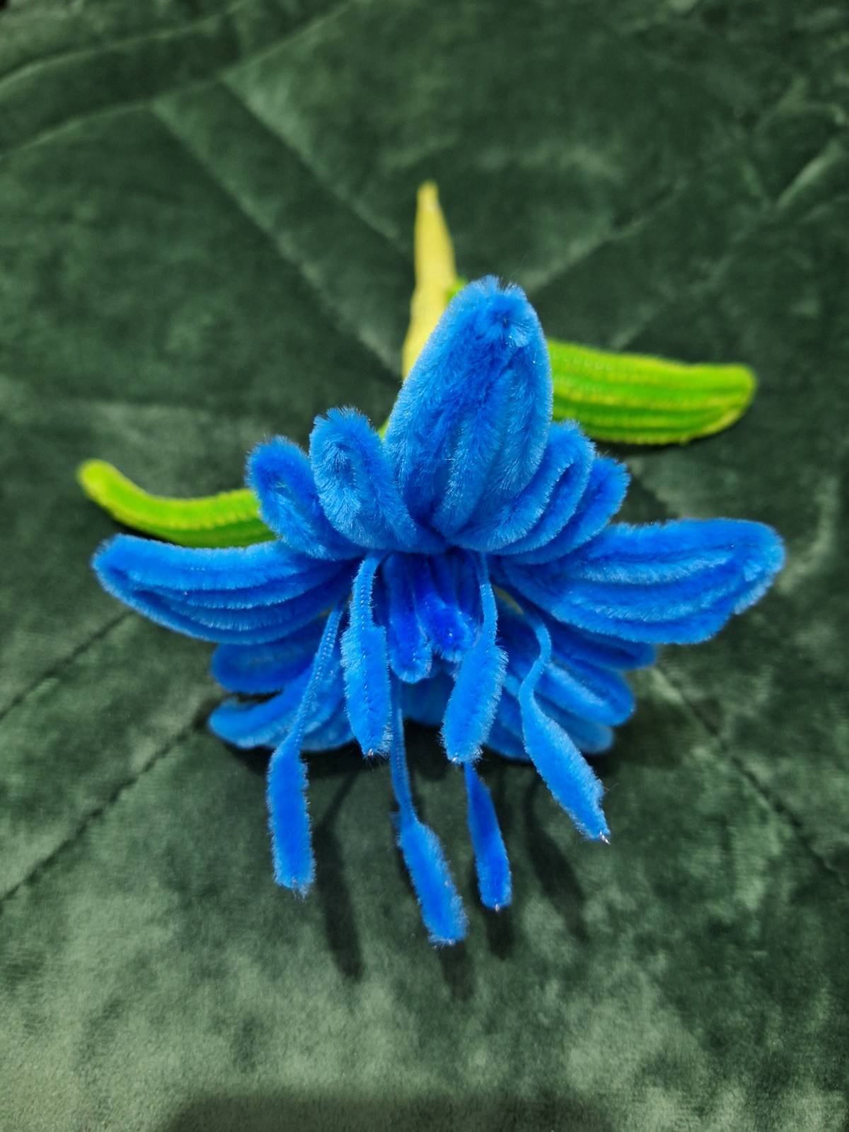 A detailed flower crafted from pipe cleaners, made by one of my clients. 